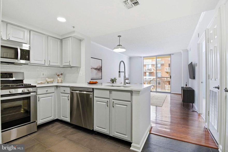 This one truly has it all!  From thoughtful kitchen and bath renovations to underground parking (EV chargers in the community garage!) and extra storage, this sun-soaked one-bedroom condo complete with a private balcony and a young HVAC system is sure to check every last box on your wishlist.  From the moment you step inside this 6th floor foyer you'll feel the level of care taken on by its current owner.  A recent kitchen renovation features Quartz countertops, tasteful blue-grey cabinetry, classic subway tile backsplash, sleek tile flooring, recessed lighting, and a modern under-mount sink with chef-style faucet.  Hardwood floors flow through the open living and dining area complemented by a charming updated chandelier and fresh, neutral paint throughout.  The spacious bedroom offers brand new carpeting and two open-concept walk-in closets. The large dual-entry bathroom is both functional and inviting, with a replacement white vanity, marble countertop, young fixtures and lighting, a tub and shower combination, and easy accessibility from both the bedroom and main living space.  Step outside to a generously sized private balcony overlooking the community’s central green courtyard with western-facing exposures, an ideal spot to enjoy a quiet morning or a beautiful sunset.  Additional highlights include brand new carpeting (2026), new HVAC system/water source heat pump and thermostat (2019), upgraded kitchen appliances (2018), updated washer and dryer (2018), one assigned underground parking space, and a private storage unit.  Lexington Square is a well-loved Ballston community known for its low condo fees and excellent amenities, including a fitness center and outdoor pool. Just blocks to both the Ballston and Virginia Square Metro stations, you’ll also enjoy immediate access to some of Arlington’s most popular spots including Ted's Bulletin, JINYA Ramen Bar, Hawkers Asian Street Food, The Salt Line, and the shops and dining at Ballston Quarter (with a Call Your Mother location on the way). With easy access into Washington, DC and Reagan National Airport, this is truly low-maintenance living in one of Arlington’s most connected and vibrant neighborhoods.