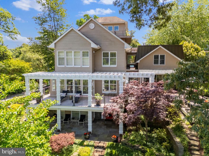 Coveted West Annapolis Waterfront property with deep water floating dock! Recently updated with fresh paint, refinished floors and new carpeting throughout. Experience elegance and grace in this stunning 4 story home that is sure to captivate. The contemporary architecture and voluminous spaces mixed with traditional finishes and floor plan creates a wonderful combination. Expertly designed and built additions include the glass enclosed lanai with elevator and guest room above in 2006, Living room, 2 car garage and bird's nest with balcony completed in 2009, gourmet Kitchen was expanded and beautifully updated in 2015. Upon entry, the soaring foyer is awe-inspiring and the elegant living room, with built-in bar, sets the tone.  With 3 custom bars and multiple gathering areas, this home is perfect for entertaining.  The gourmet kitchen is a chef's dream, featuring a large island and top-of-the-line finishes and breakfast nook, which flows seamlessly into the spacious family room with walls of windows overlooking Weems Creek. The adjacent library/den boasts mahogany built-ins and flooring, gas fireplace and views; a perfect place to curl up with a book. This home offers three ensuite bedrooms for ultimate comfort and privacy. The master bedroom is a sanctuary with a vaulted ceiling, custom built-ins, enormous walk in closet for 2 and the best views in the house.  Wake up every morning and enjoy the activity on the sparkling waters of the creek and the Severn River. The spacious guest room suite with glass breezeway from the main house boasts an elevator directly into the room, creating a truly private oasis for guests and family. This floor also includes an additional bedroom or theater room with adjacent hall bath; providing flexible living options. The fourth floor features a unique bird's nest with elevator access and a wrap-around deck offering panoramic views of Weems Creek and the Severn River. With three elevators throughout the house, accessibility to all four levels is effortless. The exquisite sunroom with folding glass doors epitomizes indoor/outdoor living. Simply open 2 sides of the room to the outdoors and let the party flow onto the sprawling rear deck. The wrap-around IPE deck and multiple level seating areas are ideal for taking in the incredible views from every vista. The lush landscaping and stone stairs lead to the water's edge and the private pier with deep-water floating dock with multiple slips can accommodate a 50ft yacht. Be sure to not miss the stone patio on the way down; ideal for relaxing as the sun sets. This property truly captures the essence of waterfront living by blending luxury and comfort in an unparalleled setting. Welcome Home!