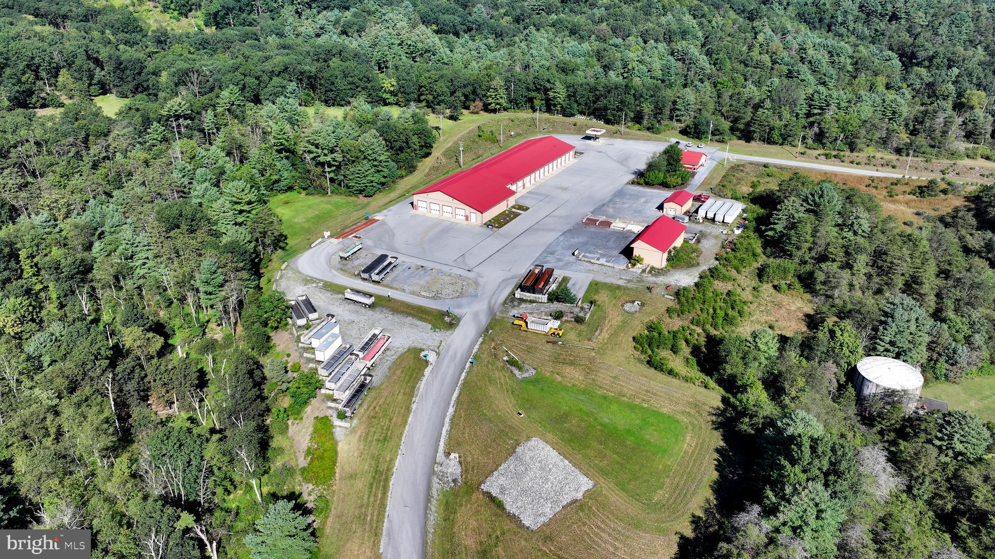 For Sale or Lease. Like new, perma column constructed buildings built in 2011. The buildings sit on 15.084 industrially zoned acres. The main building is approximately 24,000 square feet, with nineteen (19) drive in bays. Two bays are truck wash areas with recycled water system and heated floors. The shop area has four drive in doors, and a parts delivery door. All with heated floors. Ceiling Height truck storage area 16'6', wash bays 16'6" , shop area 19'6" and 14'6" in parts room. Main OHD's are 14' X 14'.
600 AMP three phase electric to main building. 200 amp service to office.
There is also a freestanding 2,500 square foot finished office building.
Access Route State Route 61 from a traffic controlled intersection.
The property is situated nicely between I-81 Frackville (approx. 18 Miles) and 1-78 Hamburg (approx. 7 Miles).
Owners will consider leasing some or all areas of the yard and buildings.
Below is a link to aerial view.
https://iframe.videodelivery.net/7944f11c911ddde980e09492aed639ea