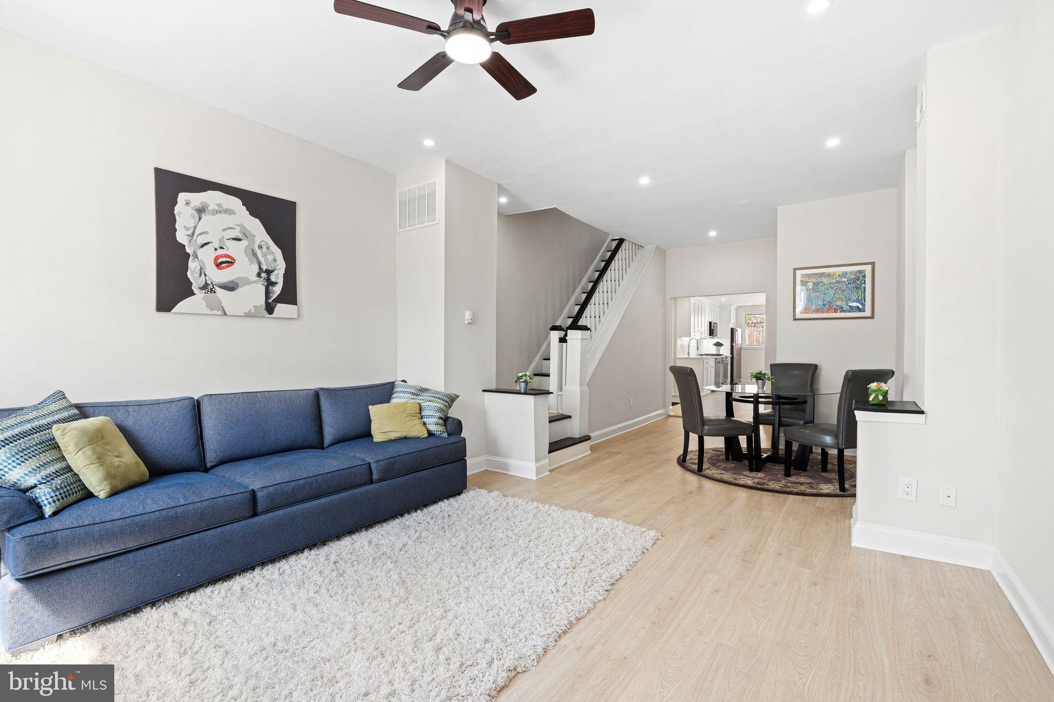 This beautifully renovated Manayunk home blends modern finishes with a thoughtful, functional layout across three spacious levels. Every inch has been upgraded — including new kitchens, bathrooms, flooring, drywall, recessed lighting, and reconfigured floor plans designed for contemporary living.
The first floor features a bright, open-concept living and dining area anchored by a sleek kitchen with stainless steel appliances, quartz countertops, and custom cabinetry. A convenient half bath and access to a private rear patio make this level perfect for everyday living and entertaining.
The second floor offers two comfortable bedrooms and a large full bathroom with a double vanity and glass-enclosed shower.
The entire third floor is dedicated to the primary suite — featuring a generous bedroom, dual closets with California Closet systems, a linen nook, a spacious en-suite bath, and direct access to a private roof deck with sweeping views of the Manayunk Bridge and Schuylkill River.
Additional highlights include:
– Built-in California Closet systems in every bedroom
– Freshly sealed basement with laundry and utilities
– Updated mechanicals and central air
Move-in ready and ideally located, this home offers turnkey convenience with elevated design — just minutes from Main Street, transit, and local trails.