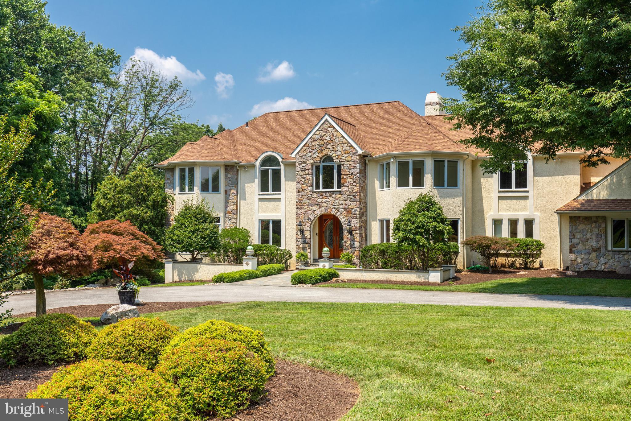 This stately residence with spectacular views of the Springton Lake has everything today’s discerning buyer could possibly want! From the European styled cafe/bar, to the in-law suite, the twelve seat home theatre, billiard room, not to mention the views, you will never want to leave this bucolic estate home. Soaring ceilings, ornate molding and impressive open staircases abound. The home is so impressive, that multiple weddings have been held in this exquisite estate. The property is outfitted with many different spaces, with options to suit your lifestyle. There are two executive offices, an au pair suite with its own entry, in-home gym, library, a finished lower level with direct access to the exterior and more. From the moment you enter the front door, your eyes are drawn to the lake view. As you make your way through the impressive floor plan, you will notice that careful attention was taken to ensure the gorgeous view of Springton Lake. From the front door, a stunning foyer welcomes you. Walk straight through to the dining room with floor to ceiling double-sided fireplace and two-story high ceilings and you are met with a wall of windows, again highlighting your lake view. Two spectacular home offices are present on the main level, and the exotic woodwork such as Honduras and African Mahogany will be sure to impress. The kitchen offers an area to eat-in near the fireplace. Outfitted with a Sub Zero refrigerator and Dacor cooktop, the kitchen offers all you need to prepare fantastic fare. The second story highlights a grand master suite with an oversized bathroom, his and hers closets, a mirrored space for an in-home fitness area, a custom wood paneled library and more. The views from the master suite are absolutely magnificent. The other bedrooms have unique and thoughtful features and built-ins as well as attractive stained glass and their own private ensuite bathrooms. The in-law/au pair suite has a private entry and is located on the lower level of the home for added privacy. This in-law suite includes two bedrooms, a kitchen, sitting area and a full bathroom. There are many uses for this great space that is ideally tucked away from the other bedrooms/living area of the home. The property offers extensive hardscaping, tiered landscaping all centered around enjoying, entertaining and preserving the view to the lake. As you take in the scenery, you may catch a glimpse of a pair of bald eagles, who nest near the lake, soaring and fishing. This estate is located within proximity of major routes and convenient to the Philadelphia Airport. One year American Home Shield Home Warranty included.