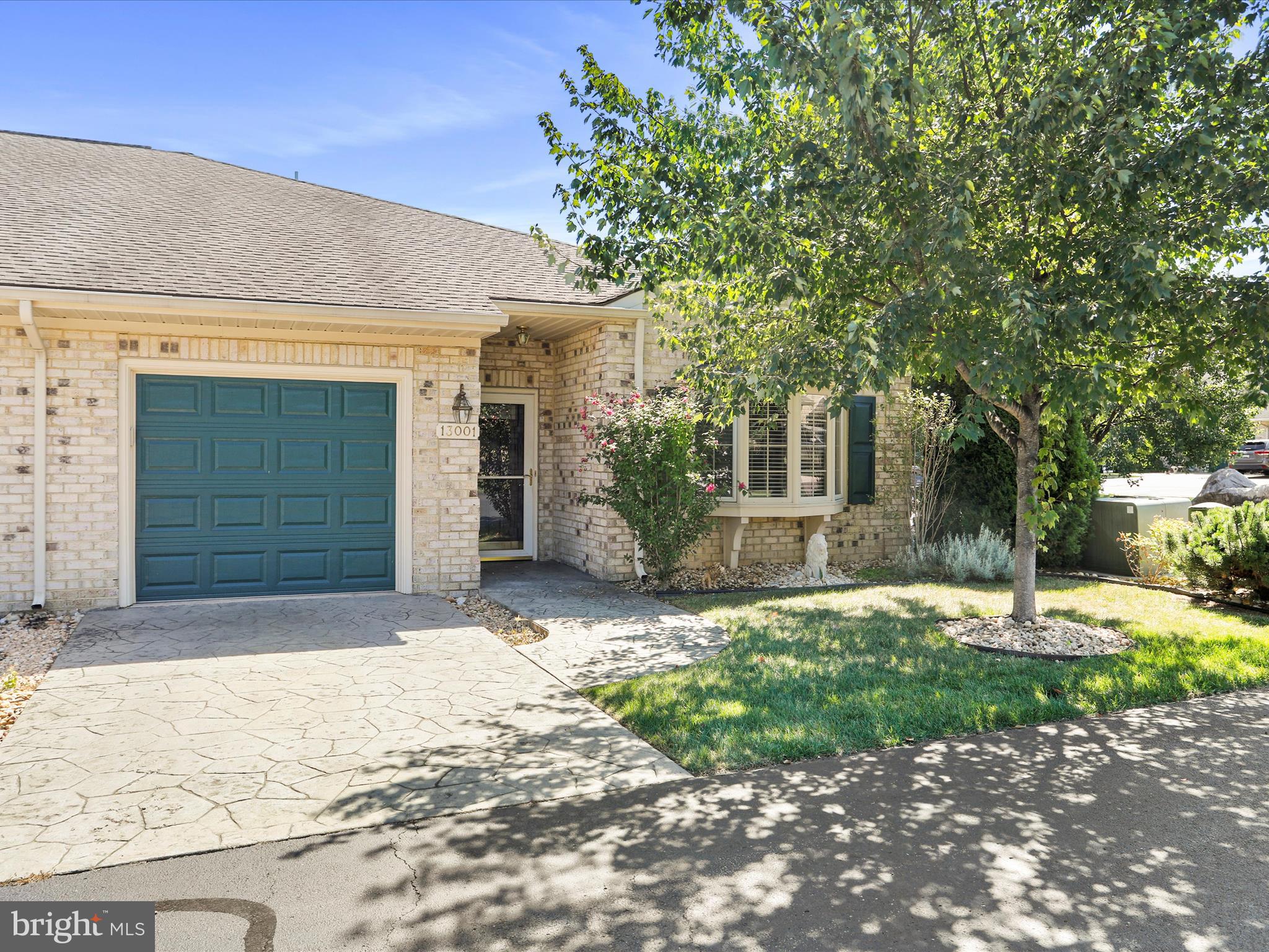 Lots of windows in this bright one-story, brick, 2 bedroom / 2 full bath END unit at Cortland Manor. It has fresh paint throughout; as well as all new carpet and new flooring in laundry area and 2nd bathroom. Great sunroom that leads out to a patio for outdoor time. New dishwasher and stove. Open and airy... one-floor, care-free living at its best! Lawn maintenance is included in the condo fee.