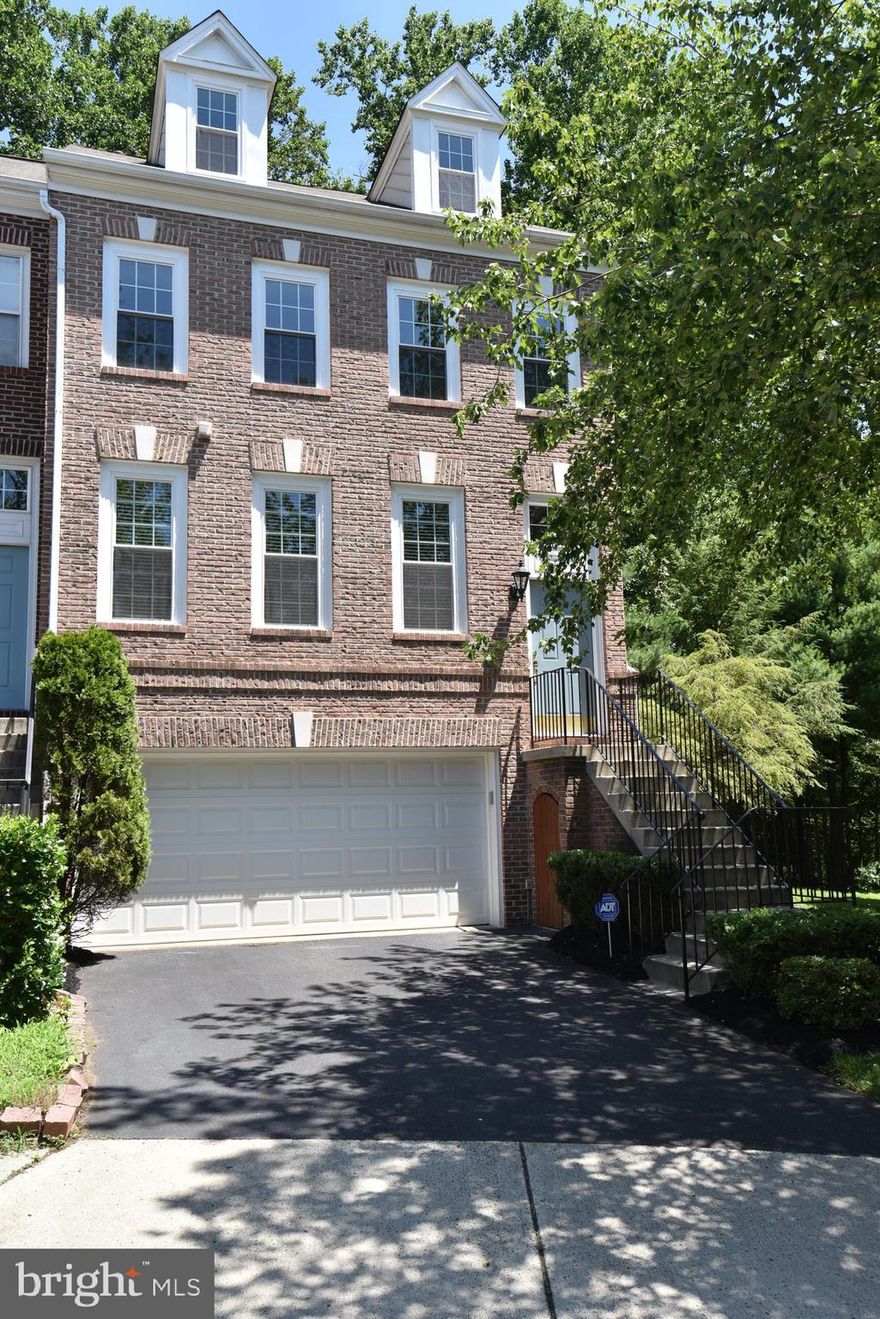 Extremely well maintain 4 level end unit in Windsor Mews . 2200 sq/ft and 2 car garages backing to woods. This is the largest model , You will enjoy new hardwood floor on main level  and new carpet on the upper 2 levels. Large  kitchen with 2 wall ovens ! new granite counter top , new dishwasher and refrigerator.  Large deck off kitchen . The upper level has a master bedroom  suite which include a master bath , walk in closet and a loft !,  2 additional bedrooms , a bathroom and a washer and dryer.  Lower level has a large Family room with  fireplace and walkout patio . It has a newer water heater and heating/AC unit . The property is conveniently located near Costco , Wegmans, Wholefood,  Fairfax Corner , Fair Oaks mall , Eagle View elementary , 2 theaters , 66 and Fairfax County parkway .