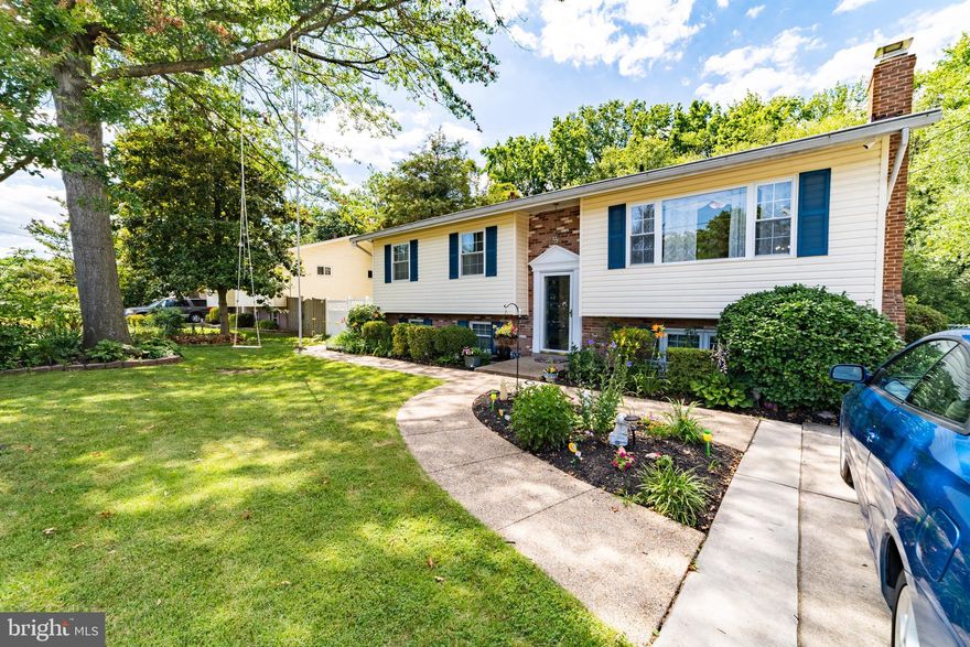 Nicely updated, 4 Bedroom, 3 Full  Bathroom,  Home with Hardwood floors on the main Level, Newer Kitchen, New Bathroom, Laminated Floor on lower level,  Family room with wood stove and Full bath, plus huge storage/laundry area and walk-up basement to fully fenced rear yard with on sheds,  Ready to make your home! Spacious eat-in kitchen has large pantry with pull out drawers, lots of light in this home!