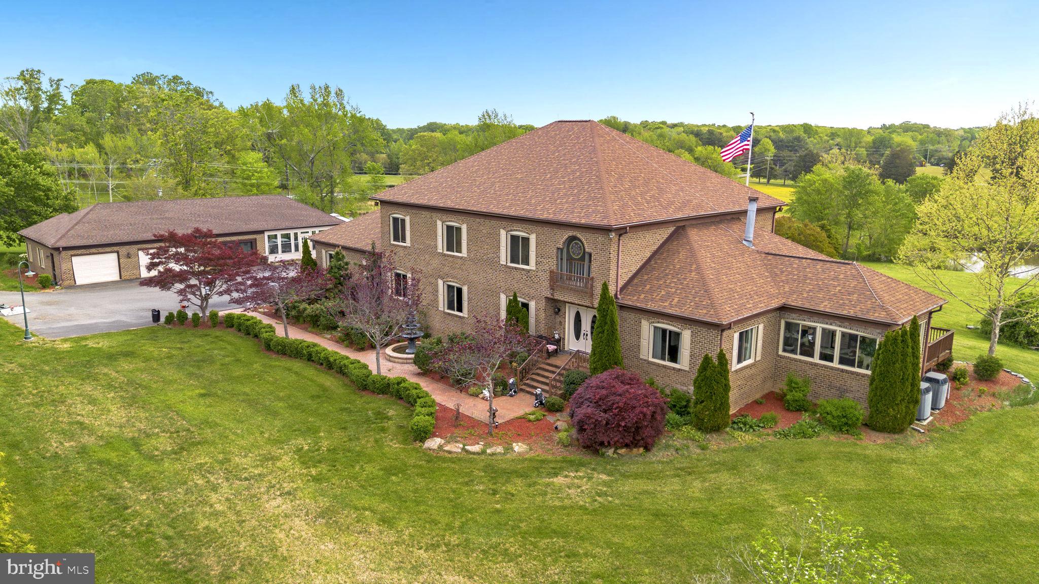 Property is located on 12.4 acres of land and consists of:
• 5,700 square foot all brick home – 2 story with full basement
• Detached, oversized, 4 car garage and party room
• In ground pool
• 2000 square foot shop
Main Home:
Ready to occupy. Brand new 50 year warranty roof. Dual zone HVAC with heat pump
and electric aux heat upstairs and a heat pump with gas aux heat for the first floor and
basement. Dual water heaters (one gas and one electric)
Top floor
4 bedrooms and 3 full baths. Upstairs floors are all carpeted except for
bathrooms, which are ceramic tile. All 3 full baths have granite counters. 3 Bedrooms
are average size and master bedroom suite is very large with 2 walk in closets.
Main floor – all 9 foot ceilings with crown molding throughout
Huge kitchen with large walk-in pantry, eat in kitchen area and separate
coffee/breakfast nook. Kitchen has all cherry cabinets, granite counters, and hardwood
floors. All stainless finish appliances new in 2016
Huge dining room with hardwood floors
Carpeted living room with gas fireplace (gas fireplace is located on inner wall and
is visible from both the living room and den)
Large den with wet bar and adjacent full bath. Den has hardwood floors.
Large sunroom with southern exposure and lots of windows (overlooks large
pond). Sunroom has ceramic floors and double sliding glass doors that open onto a 16
foot by 14 foot deck
2 story foyer with “widow’s walk” that overlooks the front yard. Foyer and main
hallway are hardwood floors. Main hallway has exit with 4 steps down into attached
oversize 3 car garage
½ bath off the main hallway with granite counter and ceramic floor
Huge laundry room with deep sink. Laundry room has ceramic floors and has a
granite counter
Additional Room for a photo studio. Room has a 10 foot
ceiling, lots of windows and an access door to the garage. This could be a bedroom,
albeit without a closet.
Basement foyer accesses large room that could be a bedroom (no closet) but
would also be an ideal in-home theater. Room is carpeted.
Large full eat-in kitchen with granite counters, ceramic floor and full complement
of appliances (including dishwasher)
Equipment room that includes 1st Floor HVAC equipment, water heaters, deep
sink, and washer/dryer hook-up.
Large game room with ceramic floor and attached gym (gym is large enough for
my bowflex and Jane’s treadmill)
Large guest suite with huge walk in closet and carpeted floor.
Full bath (shower only – no tub) and ceramic floor
Main hallway that has ceramic floor and exits with 5 steps up into the garage
Party room: Large party room has HVAC . Party room is all ceramic floor
Full kitchen with all appliances (including dishwasher) and water heater
Full bath with tub and shower.
Sliding glass doors that open onto 24 foot by 30 foot deck. Deck overlooks
swimming pool.
Swimming pool has separate building that houses the pump and filter. the pump runs 24/7 during the swimming season, there is a timer that allows you
to turn it on and off.
Concrete floor, insulated metal building
Hot water and half bath and full HVAC.
Installed 80 gallon air compressor.
Loads of electrical outlets and separate electric meter.
12 foot ceiling in main bay with hydraulic lift.
Workshop:
Miscellaneous:
Property has 2 very deep wells. One well provides water to the main house and
the other provides water to the shop and party room.
Property has 2 septic tanks. One tank is for the main house and party room and
the second is for the shop.
5 zone underground sprinkler system waters the front yard, all the plant beds
around the house, and the vegetable garden.
Dedicated garden location is enclosed in landscape block wall.
House has an emergency transfer switch that allows you to connect a generator
(minimum 8kw) to a receptacle in the garage for emergency