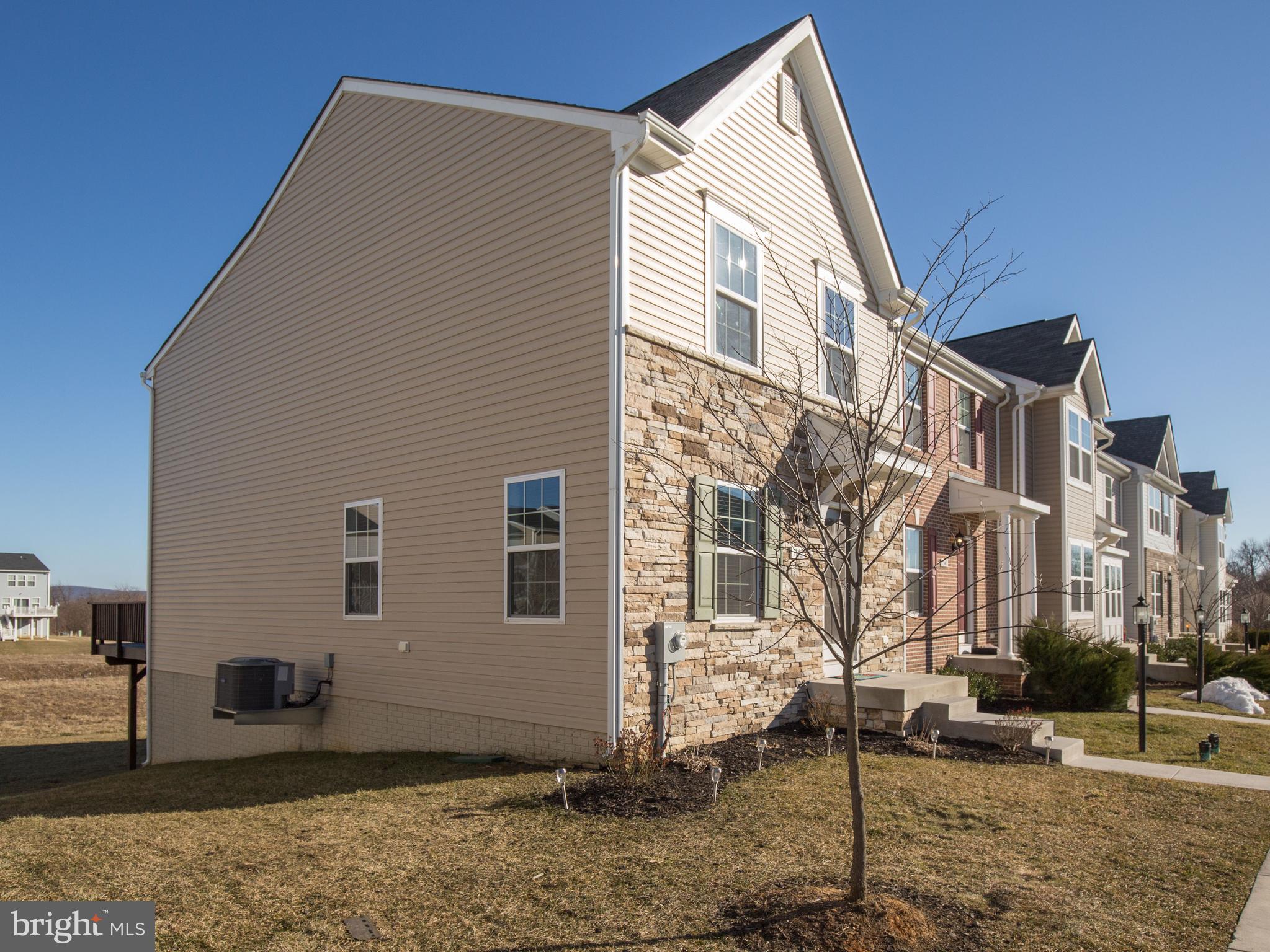This 3-level easy living end townhome isn t just gorgeous - it also has a great view and is convenient to shopping, restaurants, playgrounds and commuter routes. Inside easy care laminate floors run throughout the main living area that includes the living room, eat in kitchen with upgraded 42'' dark cherry kitchen cabinetry, powder room and a morning room bump-out that leads to deck. Enjoy the breeze and soak up the view of the mountains from the deck overlooking the open common area. **Upstairs the spacious master bedroom with bump out features a walk-in closet and private bath with soaking tub, separate shower and dual vanities. Bedrooms two and three are nicely sized and have good closet space.** Laundry is locate on the ready-to-finish lower level that is waiting for you to make your own. French doors add natural light and contribute to the open feel. There is even a bathroom rough in so you can add an additional bathroom. **Kick back and enjoy the freedom of no yardwork - HOA fee includes snow removal, mowing and trash.