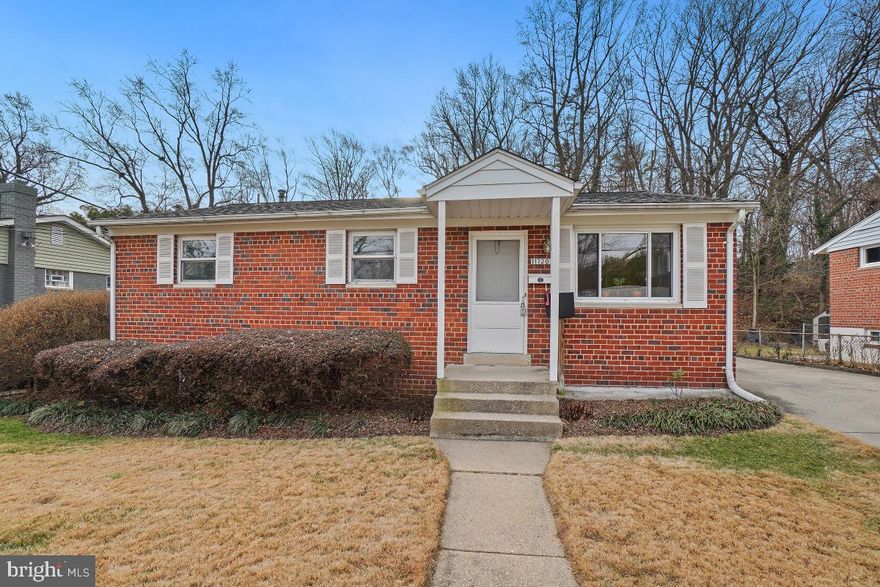 This is the perfect home for a large or extended family!   Troy Road features a spacious family room 
addition, five bedrooms, including a primary bedroom with a wall of closets and an ensuite bath.
There are four additional full baths, a kitchen, and laundry area on both the primary and lower levels, and an oversized  two-car garage with electric, built-in shelving,  and a walk-up attic for extra storage.   The upper level kitchen has a breakfast bar, white shaker style cabinets and granite counters.  The lower level is nicely finished and includes a family room, two bedrooms with egress, an office, three full baths, a kitchen, laundry, and an exit to the rear yard.  This home is situated on one of the larger lots in the neighborhood and backs to parkland.  Special features include a covered front entry, hardwood floors, double pane windows, updated kitchen and baths, granite counters, recent roof, upgraded electric service, separate HVAC for the addition, a tiered landscaped, fenced rear yard, shed, and extended concrete driveway with lots of space for parking.  Great location...just steps to Rock Creek Park. Close to the shops and restaurants in the neighborhood shopping center, the North Bethesda metro, MARC, and Black Market restaurant in Garrett Park.  Easy access to major transportation routes...both I-495 and I-270 and just minutes to the Pike and Rose District and all of the shops and restaurants along Rockville Pike.