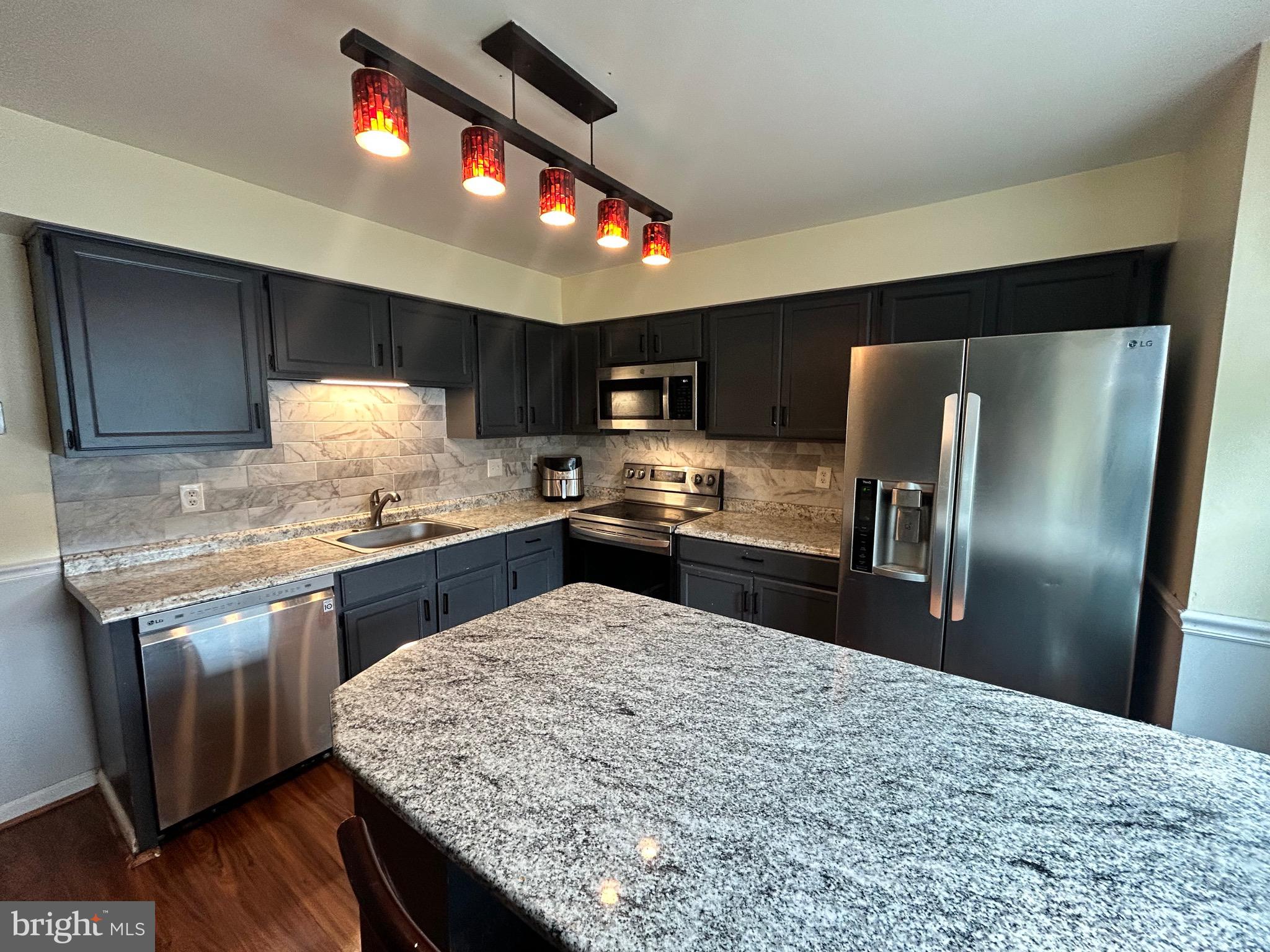 Welcome to 254 Inverness Circle, one of the few townhomes currently available in the desirable Brittany Farms - Highlands community in Chalfont! This 4-bedroom, 3.5-bath end-unit offers over 2,300 sq ft of finished living space, a detached garage, and multiple outdoor areas — all tucked away in a quiet cul-de-sac backing to trees for added privacy with a fenced-in yard.
Inside, you’ll love the open-concept layout, remodeled kitchen (2021) with granite island and stainless steel appliances, and the cozy pellet stove in the living area. Upstairs, the spacious primary suite features a walk-in closet and updated bath, with two additional bedrooms and full hall bath.
The finished two-tier basement provides incredible flexibility — complete with a bonus bedroom, full bath with jacuzzi tub, and a walk-out to the covered patio and fenced backyard. Perfect for a playroom, gym, office, or guest suite.
Other highlights include:
Fenced yard backing to mature trees!
Detached one-car garage and driveway parking!
End-unit privacy and natural light!
Top-rated Central Bucks School District!
Walking distance to elementary school, close to parks, shopping, and major commuter routes!
Sellers are prepared to review strong offers immediately. Don’t miss this opportunity!
Homeowner is listing agent and holds a Pennsylvania Real Estate License.
