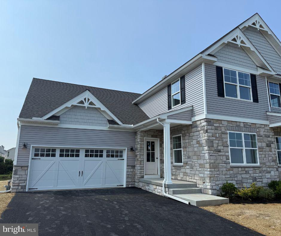 This Crestwood Traditional is a 3 bed, 2.5 bath duplex featuring an open floorplan and first-floor Owner's Suite. The Family Room, with cathedral ceilings and a gas fireplace, opens up to the Dining Area and Kitchen with eat-in island and pantry. The upgraded kitchen features quartz countertops, tile backsplash, gas range, 42" cabinets, crown molding, and garbage disposal. The entire living area has a cathedral ceiling. The first-floor Owner's Suite has a private full bath and large walk-in closet. The ensuite bathroom features a double-bowl vanity with quartz countertops, tiled-wall shower, and linen closet. The Laundry Room is conveniently located on the first floor. A private Study is located at front of home. The entire first floor is finished with engineered plank flooring. 2 additional bedrooms with walk-in closets, a full bath with tile floor, and small Loft area complete the second floor.
The unfinished basement provides an additional 1,402 square feet for future expansion. 2-car Garage included.
Welcome to Somerford at Stoner Farm Carriages, a new community of custom attached homes in Lancaster, PA. With a prime location on a 56-acre community that borders the beautiful Stoner Park, Somerford at Stoner Farm Carriages offers a tranquil atmosphere that is perfect for families seeking a peaceful retreat. This community is well-suited for new homeowners with its excellent schools and nearby parks. The atmosphere here is warm and friendly, with four distinct seasons that offer something for everyone, from summer festivals to winter wonderlands. Somerford at Stoner Farm Carriages is just minutes away from downtown Lancaster, where you can find unique shops, restaurants, and entertainment venues. The area is steeped in rich history and culture, with many museums and galleries showcasing the region's heritage. Join the 12+ homeowners that have decided to build in Somerford at Stoner Farm Carriages.
Price shown includes all applicable incentives when using a Keystone Custom Homes preferred lender. Price subject to change without notice.