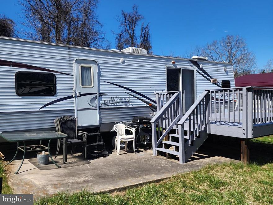 Just listed in sought after River Bend. This lot includes a 2006  camper and is only 1 block away to the Potomac River! The camper can sleep six people: 1 bedroom, sleeper sofa and the table can convert to a bed.