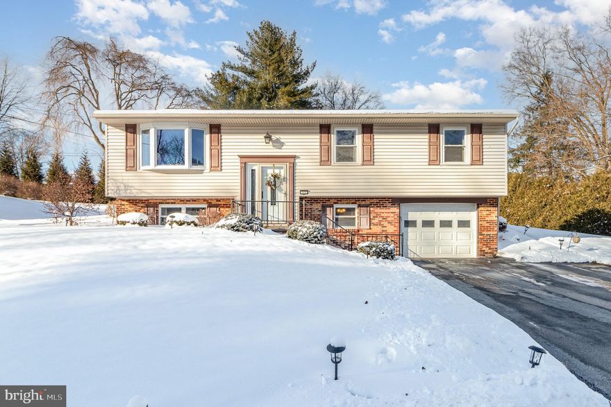 Welcome to this warm and inviting 4-bedroom, 2-full-bath home in Dauphin! From the moment you step inside, you'll appreciate the gleaming hardwood floors, updated carpeting, and beautifully tiled bathrooms with glass shower doors. The stainless steel kitchen appliances and modern lighting add both style and convenience, while the warmly painted rooms create a welcoming atmosphere.

The finished lower level with a cozy woodstove offers the perfect retreat, and the laundry/mud room off the garage adds everyday practicality. Enjoy outdoor living on the covered back patio overlooking the easy-to-maintain yard.

With its move-in ready condition, this home is waiting for its next owner. Any way you look at it, this is home!