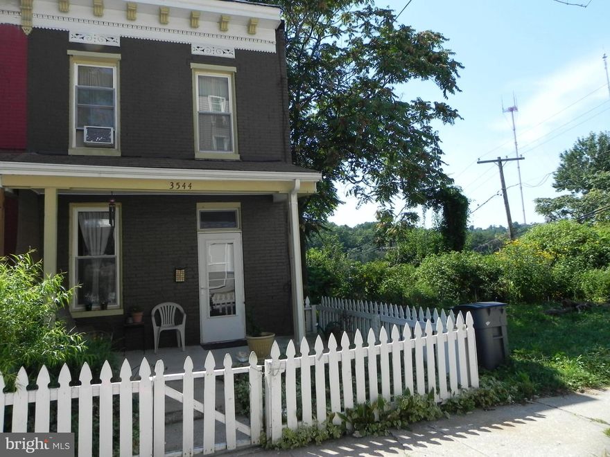 New Price! Cute porch front home in Historic Hampden in a really convenient location. Great starter home w/really spacious kitchen with lots of potential for design. Hardwood floors thru-out. Two bedrooms - one full bath internal to the rear bedroom. Generous bedroom sizes. Full size front loading W/D in basement. Newer furnace, new screens, many updates. HOME WARRANTY INCLUDED.