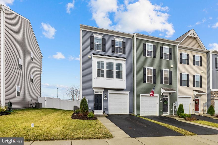 Built in 2023, this beautifully maintained end-unit townhouse at 101 Union Ridge Drive in Charles Town offers modern finishes, comfortable living space, and a convenient location close to everything the Eastern Panhandle has to offer. With 3 bedrooms, 2.5 baths, and 1,724 square feet, this home combines contemporary style with low-maintenance living.

The main level features 9-foot ceilings and an open layout designed for everyday living and entertaining. Luxury vinyl flooring runs throughout the lower and main levels, while the living room features a cozy electric fireplace and ceiling fans for added comfort.

The kitchen is both stylish and functional with quartz countertops, stainless steel appliances, a center island, and plenty of cabinet space. The dining area opens directly to a Trex deck, perfect for outdoor dining or relaxing in the evening.

Upstairs, the bedrooms are comfortably carpeted with the primary bedroom offering a private bath with shower, double sinks, walk-in closet and vaulted ceiling, while the lower level offers additional flexibility, including a closet with a rough-in for a future bathroom.

Outdoor spaces add even more appeal. The fully fenced backyard with a vinyl privacy fence provides room to relax, garden, or entertain. A concrete patio with a charming porch swing creates a cozy spot to unwind. Behind the home, tall trees offer partial screening of the nearby high school sports fields, making this one of the few homes on the street with added privacy.

Additional highlights include public water and sewer, community-metered propane, programmable thermostats, and a one-car garage.

Residents enjoy community amenities including walking trails, tot lots, tennis courts, basketball courts, and a community pool scheduled for completion this season. The location offers convenient access to Charles Town, Ranson, Martinsburg, commuter routes, shopping, and dining.