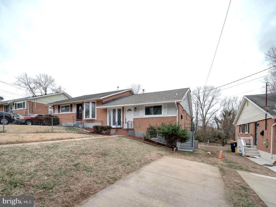 Welcome to this renovated duplex in Temple Hills, MD. A stone's throw away from Naylor Rd metro station, this two-level home with a fully finished basement provides a well-designed layout. Featuring four spacious bedrooms and two full bathrooms, the main level boasts a bright living room space with recessed lighting and wood floors. The fully renovated kitchen features white cabinetry, quartz countertops, and stainless steel appliances.  The bathrooms had been tastefully renovated. The finished walk-out basement has a bedroom, a den, and a full bathroom. A fenced-in yard provides outdoor space for pets, gardening, or hosting. Situated in a convenient location, close to the metro, major roads, and shopping