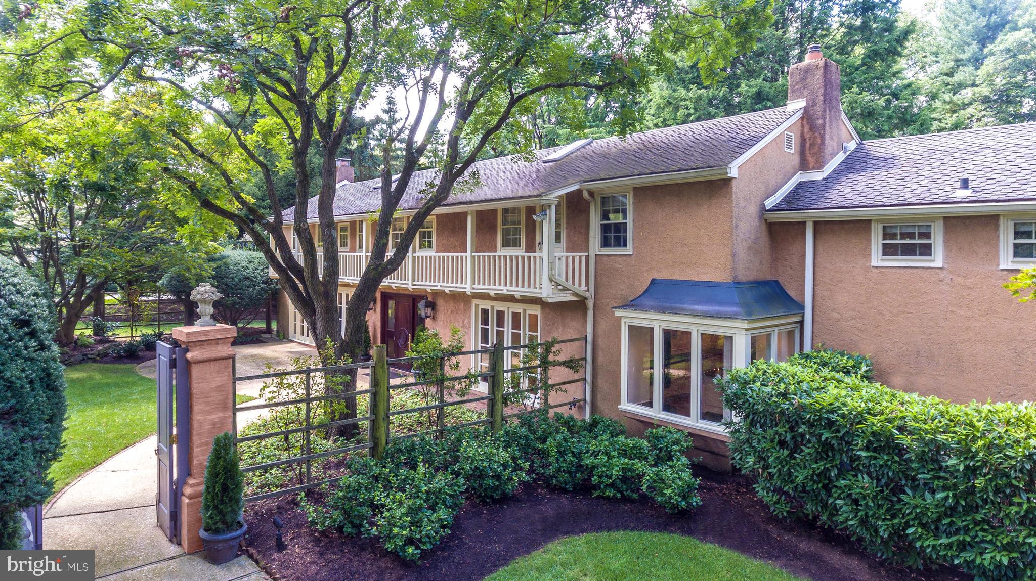 Home went under contract with lease/purchase in end of 2019. That is why the sale price is lower than current market value. Walter K. Durham "Tuscan Villa" styled Petite Estate in the most desirable quiet neighborhood of Northside Villanova. The property is surrounded by some of the foremost Estates on the Main Line and is completely private both front and back. This California "Monterey Colonial" inspired reproduction home is sited beautifully on an exceptional lot with a quintessential European courtyard and the garden style floor plan that typify Walter Durham's best Estates. Large formal Living Room with lovely fireplace, formal Dining Room with antique crystal chandelier and sconces, original paneled office, powder room and Family Room with vaulted ceiling. Updated eat-in kitchen with sub-zero refrigerator, granite counters, ample cabinetry & pantry. French doors lead to an inviting patio and gorgeous pool surrounded by lush evergreens and mature trees. There is a 2-car attached garage and unfinished basement providing convenient storage. The second floor offers 4 bedrooms & 3 full baths, including en-suite master, large sumptuous bath with dual sinks & steam shower, his & hers walk-in closets, balcony, laundry room, and a huge walk-in Cedar closet.