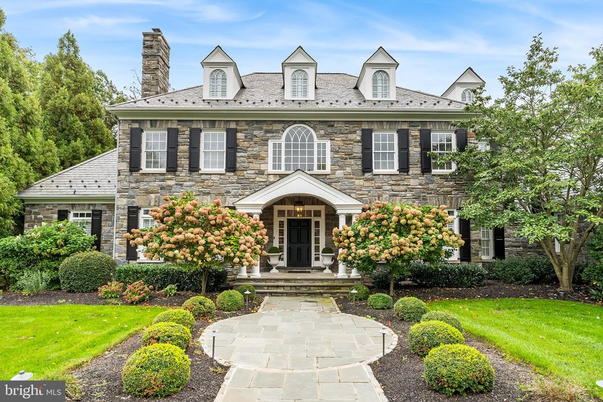Nestled among the scenic landscapes of Chester County, Malvern, Pennsylvania, you'll find a remarkable residence that seamlessly balances modern luxury with timeless elegance. Situated on over two acres within a peaceful cul-de-sac estate street, this 7000-square-foot home, built in 2001 and tastefully updated in 2018, is a testament to sophisticated living.
With four finished levels, six bedrooms, and nine baths, this home offers an abundance of space and amenities to satisfy even the most discerning tastes.
Upon entering, you'll find the primary bedroom on the main level, complete with a spacious en-suite bath and walk-in closets. This level also features a cozy fireside living room, a bright den, and an elegant formal dining room, ideal for hosting gatherings.
The heart of this home is its exquisite white kitchen, seamlessly connecting to a generously sized family room with a fireplace. These spaces effortlessly flow to an outdoor oasis featuring meticulously manicured gardens, a sparkling pool, a charming pool house, and an inviting outdoor fireplace. For a break from the sun, a covered deck provides the perfect escape while maintaining a connection to the pool area.
The lower level offers versatile living spaces, including a guest bedroom with a full bath, a convenient laundry room, and areas for recreation, fitness, and relaxation. Stairs from this level lead directly to the pool, enhancing the indoor-outdoor living experience.
The second level of the home accommodates family and guests with spacious bedrooms and ample closet space.  A third floor provides additional flexibility, suitable for in-laws or long-term guests. Each Level comes complete with its own Laundry room. 

This well-maintained residence sits back from the street, offering privacy and an attractive façade with carefully landscaped gardens. The renovation spared no expense, resulting in high-quality finishes, a professional color palette, and an enviable Chester County location.
In this serene haven, you'll find sophistication, convenience, and luxury thoughtfully combined. This is more than just a house; it's a testament to tasteful living in Chester County. Welcome to a place where refined living meets tranquility.