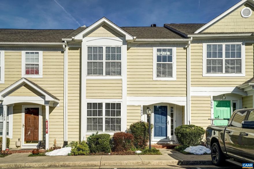 Updated and pristine 3 level, 3 bedroom 3.5 bath townhome in River Run.  Primary upper level en suite offers skylights, ceiling fan, double sink vanity, separate tub/shower and large walk in closet. Guest en suite with private bath. Main level kitchen has been updated with new flooring, countertops, appliances, pull out trash drawer, painted cabs and pantry. Open dining / living room with chair railing, wainscoting, and custom built-in cabinetry around wood burning fireplace. Elevated deck overlooks tree and roof tops. Walkout fully-finished lower level (currently used as a bedroom) complete with updated ceramic tile full bath, laundry room and ample storage. Neutral palette throughout. Hardwood flooring on main level and upper staircase and hall. Bright two story entry.  Assigned parking right out front.,Painted Cabinets,Fireplace in Great Room