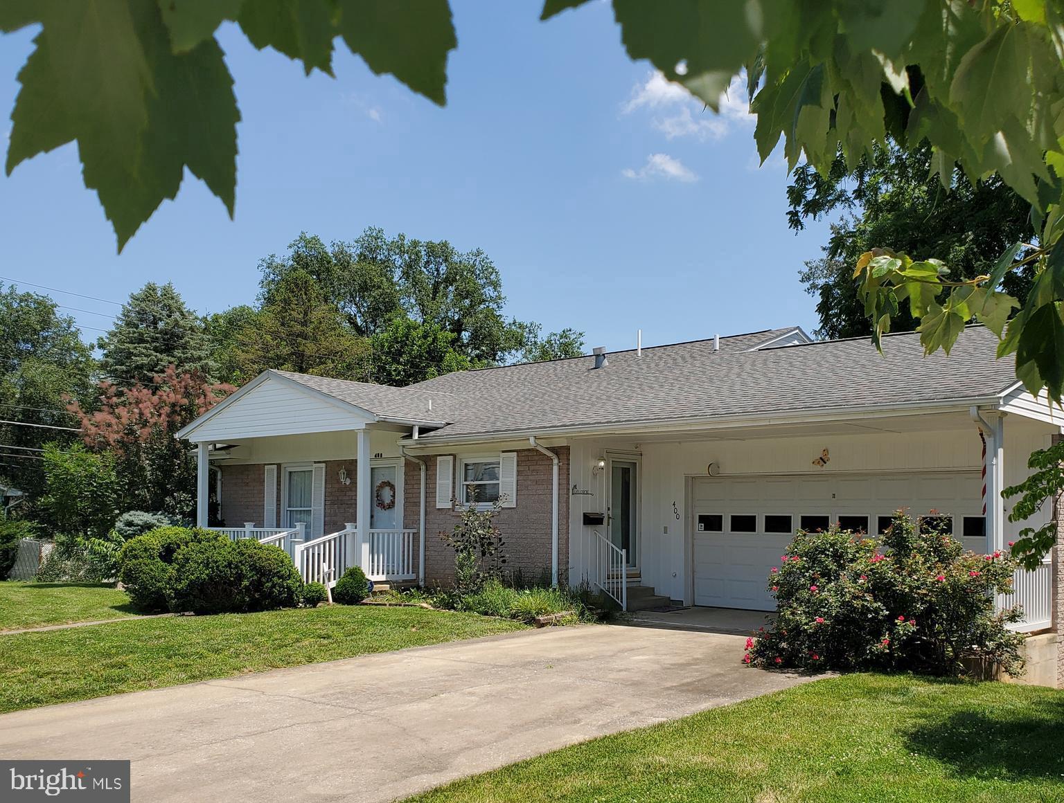 FEELS LIKE HOME !!! What's not to like about this Charming Split Stone Home built in 1964. It has been lovingly cared for & offers all the modern conveniences. This home has 3 Bedrooms with Hardwood Floors, 2 Baths, Natural Gas Fireplace in Family Room, Large Laundry / Kitchenette Room on lower level, & Delightful Sun Room to enjoy year-round. Partial unfinished basement off lower level provides approx 400 sq ft additional storage.Roof has ben replaced appprox 4 yrs ago, Heating is Forced Air Natural Gas & Central A/C. 2 Car Garage, Fully Fenced Rear Yard with additional parking area at side gate. Located on a Corner Lot - in the well establised west end of Martinsburg just minutes from Park, I- 81, Hospital, Shopping & Downtown . Seller prefers Pill & Pill for closing. Easy to Show - Come see the Possibilities - Must See to Appreciate !!! Please Note -No Home Sale Contingencies when writing an OFFER