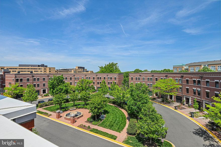 Open Houses canceled. Property is under contract!  Welcome to 12127 Chancery Station Circle!  This elegant 4-Level Townhome is in West Market, a rich collection of stylish all brick townhome residences located across the street from the live-work-play oasis that is Reston Town Center. The Town Center offers a vibrant mix of dining, nightlife, shopping, entertainment, and more all within walking distance of 12127 Chancery Station Circle.  The West Market townhomes combine the best of both worlds – the charm of a traditional neighborhood with the walkability of a bustling urban lifestyle. Commuting is a breeze with Reston Metro station within walking distance as well as Reston Hospital.  With easy access to major roadways, convenience is at your doorstep.  This exquisite 4-level townhome features a thoughtfully designed layout with 3 outdoor entertaining areas and an open-concept main living area all flooded with natural light. The main living area highlights a spacious kitchen with stainless steel appliances, crisp white cabinetry, wine bar and beverage cooler. The kitchen opens up to a wonderful deck with remote control awning and wind sensor.  Also on this floor, you’ll find a sunlit great room with a dining and family room area. The lower level features a tiled foyer, spacious closet, access to the garage (with EV charger), a full bathroom, and a bedroom. This versatile room could be used in many ways – bedroom, exercise room, guest suite, or office.  It also provides access to the brick patio and fenced backyard.  The 2 bedrooms on the 3rd level feature ensuite bathrooms and flank the newly remodeled laundry area with an LG Tower Washer/Dryer and barn door.  Head up to the 4th floor and find a great room with wet bar, beverage cooler, shelving, gas fireplace and access to the beautiful rooftop deck – making entertaining a dream. Enjoy exceptional views of Reston and the Reston skyline from the rooftop terrace. This location can’t be beat – walking access to Reston, walking trails, the W&OD trail, Reston Metro, Reston Hospital, commuter routes, and Dulles Airport all minutes away! If you’re looking for an exceptional in-town lifestyle with a suburban feel, this is the home for you!