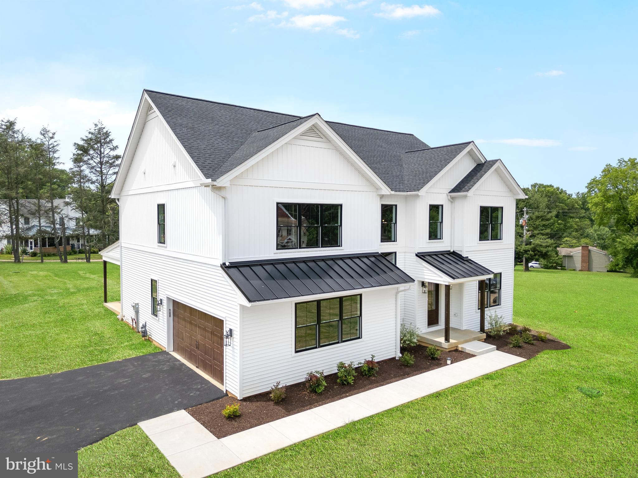 Discover an exquisite masterpiece of modern luxury & timeless elegance nestled w/in the serene landscapes of Middletown Twp. A celebration of brand-new construction, 3 custom-built farm homes situated on .5 acre lots stands as a testament to impeccable craftsmanship & sophisticated design, offering an unparalleled sanctuary for discerning connoisseurs of fine living. Step through the threshold of an 8’ dr into a world of refined sophistication, where every detail has been thoughtfully curated to create an atmosphere of effortless luxury. Adorned w/ gleaming 6.5” engineered HW flrs that flows gracefully T/O the home, the expansive 2-sty entrance welcomes you w/ an air of understated opulence. The 1st flr offers an array of luxurious features, starting with a 9’ ceilings & convenient two-car att/gar that provides direct access to the interior of the home. The private DW accommodates over 5 vehicles, ensuring ample parking for guests. Inside, a PD/RM w/ brass fixtures & quartz C-tops adds a touch of elegance. The private office is perfect for remote work or study. A large, open F/Rm, complete w/ a gas F/Pl, seamlessly flows into the gourmet kitchen. This culinary haven is designed to inspire the imagination of culinary enthusiasts, equipped w/ top-of-the-line Jenn-Air S.S appliances, including a gas cooktop & wall oven. Custom cabinets by Goebelwood Ind, adorned w/ brass H-ware, & quartz C-Tops offer an unparalleled canvas for culinary creativity. The kitchen also features a butler's pantry for added convenience & walk-in pantry. The F/ LR, which can also be used as a D/Rm, showcases amazing light fixtures, enhancing the home's sophisticated ambiance. The bright & airy nature of the home is accentuated by abundant natural light streaming through Lrg windows & 3 sliders that open to a rear covered porch in the b-yard, perfect for savoring moments of al fresco dining & leisure. Designed for seamless indoor-outdoor living, the rear covered patio beckons you to enjoy the lush tranquility of nature. Embrace the serenity of outdoor living, where the gentle rustle of leaves & the warm embrace of sunlight create an ambiance of unparalleled relaxation. The 2nd Fl consists of 3 spacious B/Rms and a convenient laundry rm. The 4th bdrm is the master suite, a true retreat featuring an amazing custom bth/rm w/ spa-like amenities, including a glass-enclosed shower, free-standing soaking tub, & custom cabinets by Goebelwood. The master suite also boasts a walk-in custom closet & access to pull-down stairs. Th master suite & master bth both have tall 10’ tray ceilings. Additionally, the home includes a full Un/bsmt with 2 egress windows, eagerly awaiting someone to finish it for extra living space. This expansive area offers endless possibilities for hosting elegant parties & gatherings, enhancing the home's entertainment potential .Approaching this architectural marvel, the allure of its pristine façade captivates the senses. A harmonious fusion of classic charm & contemporary allure, the exterior boasts Aside farmhouse vinyl board & batten siding and 30-year GAF Timberline HDZ shingles, evoking an ambiance of refined grandeur. W/ meticulous attention to detail & a commitment to energy efficiency, this home offers a true sanctuary of sustainable luxury. From its Harvey fiberglass windows to its R-21 batt insulation, every element has been meticulously crafted to ensure comfort & sustainability for generations to come. Experience the pinnacle of refined living in Middletown Twp’s most prestigious enclave. Welcome home to a lifestyle of unparalleled elegance and sophistication, where every moment is imbued w/ the timeless allure of bespoke luxury. Home is conveniently located close to the following destinations R3 Wawa Train Station 2.1 mi, Downtown Media Boro 2.3 mi, Philly Airport 15 mi, Center City Philly 24 mi, Riddle Hosp .8mi, Rocky Run YMCA 1.2mi, Edge Fitness .5mi, Center City Phila 24 miles, Promenade at Granite Run .5 mi.