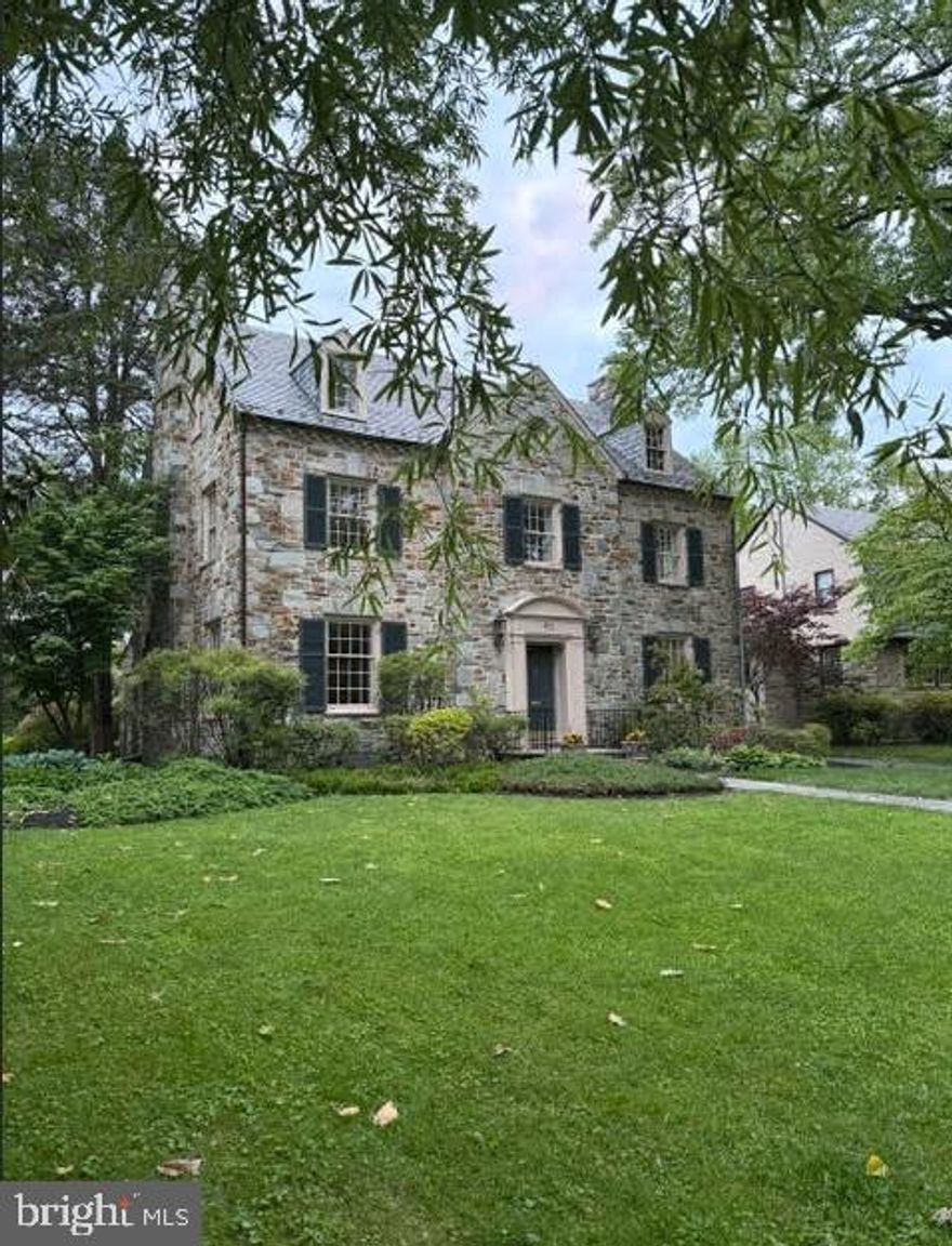 Stately Stoneleigh stone Colonial located on one of the most beautiful streets in the neighborhood! This timeless home offers incredible curb appeal, light-filled interiors, large rooms, and over 3,700 above-grade sq. ft., making it one of the largest homes in Stoneleigh. Opportunities to own a home of this size and character in the neighborhood are rare. One of the original homes built in Historic Stoneleigh, this classic center hall Colonial blends the elegance and charm of the 1940’s with thoughtful modern updates. Recent improvements include a renovated kitchen, refreshed bathrooms, refinished hardwood floors, fresh interior paint, re-glazed windows, new lower-level flooring, and freshly painted exterior shutters and doors (all completed in 2026).  A gracious foyer welcomes you into the home and is flanked by a spacious formal dining room and a sun-filled living room with a gas fireplace. Just off the living room is a stunning stone-lined sun-room featuring original stone walls and flooring, overlooking the private backyard and flagstone patio, a warm and inviting space perfect for relaxing, entertaining, or dining al fresco.  The renovated kitchen offers updated amenities while maintaining the home’s original character and charm. Throughout the home you’ll find classic moldings, original hardwood flooring, large windows, original shutters and front door details, and even a charming laundry chute.  The second floor features a spacious primary suite with an en-suite bath, along with two additional bedrooms connected by a Jack-and-Jill bathroom with an original cast iron tub. The third floor includes an additional bedroom with en-suite bath, closet space, and unfinished attic space with the potential to create one or two additional bedrooms.  The finished lower level adds approximately 750 square feet of living space and includes a large family room with a beautiful stone fireplace, workshop area, spacious laundry room, half bath, and ample storage.  Outside, enjoy the beautifully landscaped private backyard with mature trees, a charming fish pond, flagstone patio, and a stone detached two-car garage.  Living in Stoneleigh is about more than just the home, it’s joining one of Baltimore County’s most welcoming and engaged communities. Enjoy neighborhood gatherings, block parties, the community pool, and walk-ability to Stoneleigh Elementary, Dumbarton Middle School, and Towson High Law & Public Policy. Conveniently located near local restaurants, shops, the Stoneleigh bowling alley, ice cream shops, Towson Town Center, major commuter routes including I-695 and I-83, downtown Baltimore, and area hospitals.  Come experience the charm, character, and community that make this extraordinary Stoneleigh home truly special.