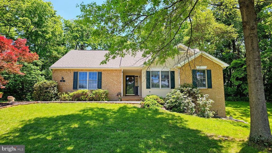 $40k PRICE REDUCTION! This picturesque rancher is set on a quiet cul-de-sac in the Maddex Farm community with an ideal location that has all of Shepherdstown within its reach.  The brick-front home is nestled into a beautifully landscaped lot that backs to trees and borders the Shepherd University Wellness Center, along with a pedestrian path that allows access to all the conveniences that Shepherdstown offers.  Combined with the opportunity for single-level living, this home has it all.  The refinished hardwood floors greet you at the door and opens to a living room that connects to the dining room and kitchen.  The made to order kitchen cabinets have a deep, warm tone and features a built-in bar, message center, and display cabinet.  The primary bedroom has a full en suite bathroom and walk-in closet and joins two guest bedrooms on the main floor.  The fully finished walkout basement has another large flexible room and a den that is great for entertaining.  New roof installed in 2025.