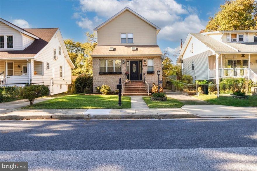 Classic Hamilton Colonial with Modern Comforts and a Private Owner’s Retreat
Discover timeless elegance in this beautifully appointed 1920 Colonial, perfectly situated near one of Hamilton’s most walkable and family-friendly neighborhoods. From the moment you enter, you’ll appreciate the open floor plan, traditional craftsmanship, and thoughtful modern updates that make this home truly special.  The living room welcomes you with rich original hardwood floors, detailed crown and chair molding, skylights, and 9’ ceilings, creating a warm and spacious atmosphere. An electric fireplace offers both charm and functionality — ideal for entertaining or relaxing with family. The separate dining room highlights the home’s character with refined trim and elegant columns, perfect for gatherings and celebrations.  The updated kitchen features recessed lighting, pendant lights over a large island, granite countertops, and ample cabinetry, including a stylish hutch. Wide patio doors lead to the recently installed composite deck, ideal for morning coffee or evening relaxation.  Upstairs, retreat to your private owner’s suite which expands the entire 2nd floor— a luxurious sanctuary with a sitting area, gas fireplace, and spa-inspired bathroom offering a jetted tub, frameless glass shower, and double granite vanity. The impressive walk-in closet provides abundant storage, and French doors open to a private deck, the perfect spot to unwind.  The flexible floor plan offers multiple living options — including family bedrooms, guest suite, home office, gym, or multi-generational setup — with a bedroom and full bath on the main level. The fully finished lower level includes two additional bedrooms, a full bath with walk-in shower, and a laundry area with a side walkout for easy access.  Additional highlights include a new water heater, a new cooktop, a recently serviced furnace that works at optimal efficiency, off-street parking, private driveway, fenced yard, ample storage, and a monitored security system for peace of mind. Set on a manageable 0.12-acre lot, this home perfectly balances comfort, character, and convenience, all within minutes of local shops, cafés, and parks. Enjoy the best of Baltimore City living — walkable, community-oriented, and full of charm — with easy access to I-95, I-895, and I-695.  Come experience comfort, character, and connection — your new Hamilton Heights home awaits!