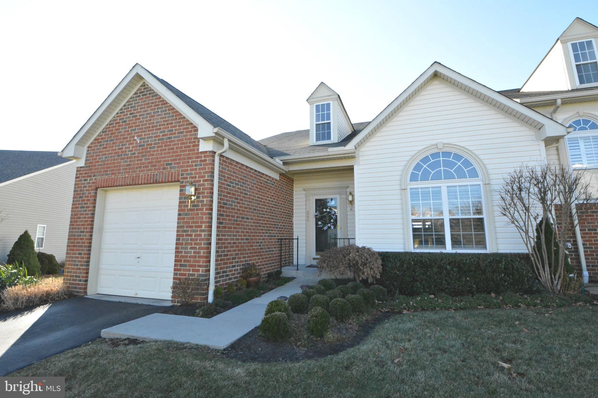 Get ready for maintenance-free living with upgrades galore. High vaulted ceilings, hardwood floors, upgraded light fixtures and modern colors. First floor laundry, 1-car garage and parking pad. Kitchen has granite countertops, updated stainless steel appliances, double oven and gas cooktop. Kitchen island, counter, and shelves accented with reclaimed wood. Also has large finished basement, bonus sunroom, and deck. Gas hookup for grill on deck. Easy access to I83 for MD commuters. One year home warranty included with acceptable offer.