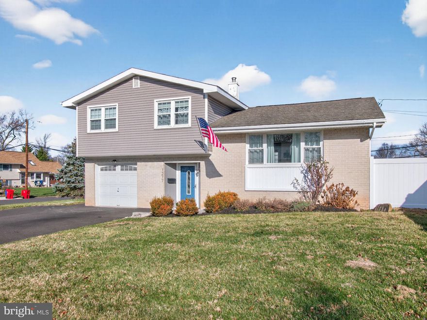 Welcome to 1277 Beverly Road in Warminster, a fully updated and beautifully finished 3-bedroom, 1.5-bath split-level home in the desirable Centennial School District, available immediately. This inviting property showcases modern upgrades throughout, including gleaming hardwood floors, gas heat, and central air conditioning for year-round comfort. The entry level off the foyer offers a versatile flex space and a conveniently located half bath. Just beyond, the nicely finished lower level provides a spacious family and entertaining area, complete with a built-in wine/beverage fridge, making it the perfect spot for gatherings, movie nights, or game days. This level also features a large, well-appointed laundry area and ample storage, adding everyday convenience and functionality.  On the upper level, the bright and open living and dining areas flow seamlessly into the updated kitchen, which features brand-new stainless steel appliances, abundant cabinetry, and generous counter space. Continue to three well-sized bedrooms and an updated full bath.  Outside, you’ll find an extra-large fenced backyard complete with a patio pergola, ideal for outdoor dining, relaxation, or play. Additional features include a garage and a private driveway providing ample off-street parking.  Combining modern comforts, thoughtful updates, and a prime Warminster location close to parks, shopping, restaurants, and major commuter routes, this home offers exceptional convenience, style, and space to enjoy.