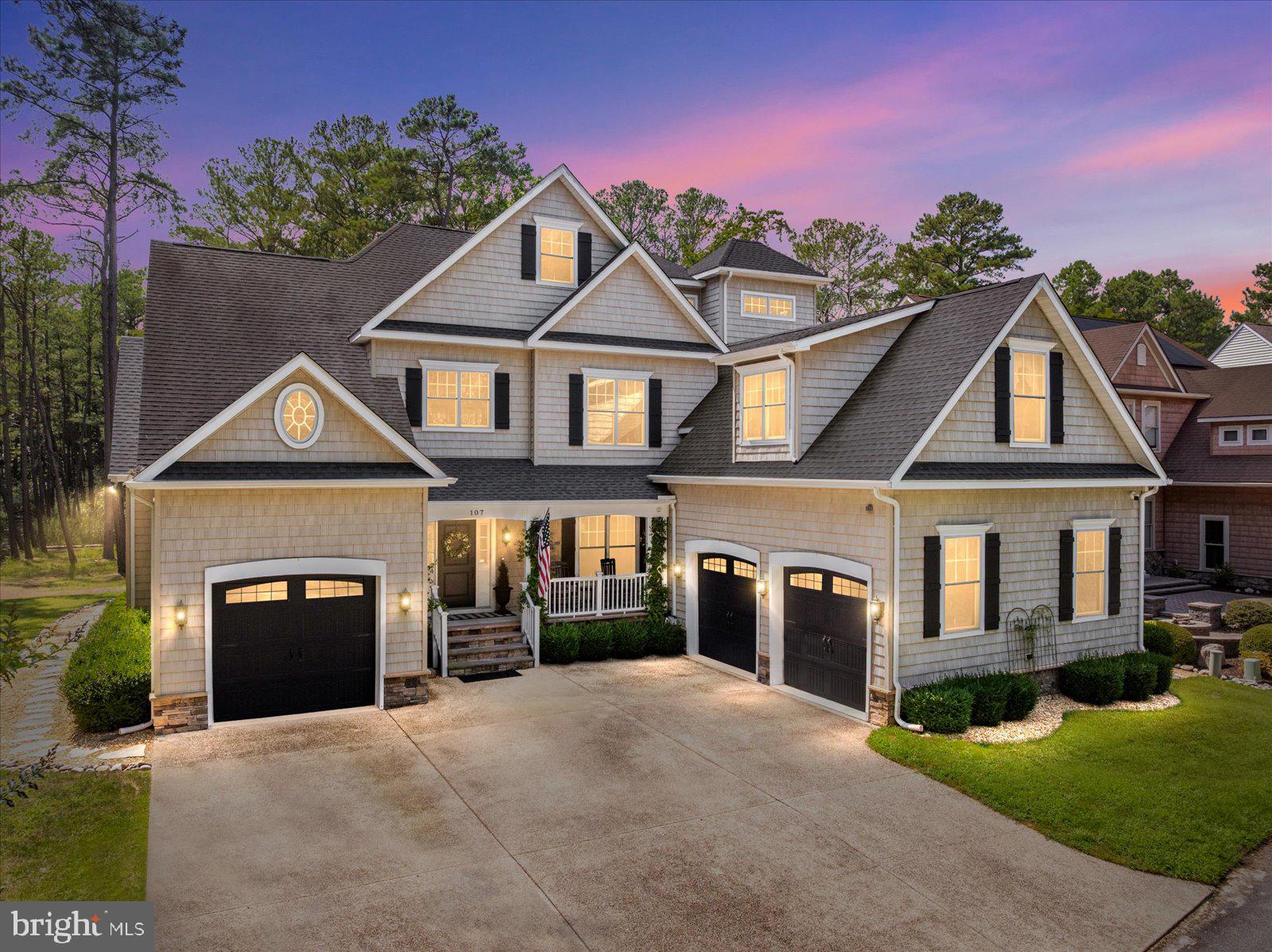 Spectacular custom built 3-story home in Whitetail Sanctuary featuring access to a private boat dock with riparian rights to Manklin Creek just across the street. Pulling up to the home you will note it features a two-car garage, an additional one-car garage, and a parking pad with space for visiting guests. After pausing on the front porch to admire the beautiful, vined flowering plants, you enter into a large foyer that leads to the formal dining room and luxurious living area. The two-story ceilings in the living room provide an open feel and offer views of the library area above. The ceilings have built in speakers that are invisible located behind the drywall providing a true surround sound experience. The built-ins provide plenty of storage and allow for an elegant look. From the living room continue to the "bird room" aptly named by the current owners. This room offers views of the acres of wildlife sanctuary that extend beyond the back yard. From the "bird room" you can access the rear deck also featuring stunning views and access to the back yard and your very own vegetable garden. Entering back into the home a lot of your time will be spent in the oversized eat-in chef's kitchen with its own gas fireplace. The kitchen has a huge island, high-end stainless-steel appliances, two sinks, and an extra-large pantry. From the kitchen walk around to the 1st floor primary bedroom that has an oversized walk-in closet and a large primary bathroom with tile shower and jetted bathtub. Venturing up to the second level of the home you will be greeted with another large living area and the library that overlooks the living room. This floor also features two guest suites and two additional large rooms that are used as sleeping quarters but could be converted into any use for the new owners. Finally, the third floor of the home is a movie enthusiasts dream come true! The third floor has its very own bar, movie projector, and electronic blackout blinds creating the perfect atmosphere for a private movie theater. Not to mention this floor has its own attached full bath, so this could be an additional sleeping area if so desired. Many of the upgrades throughout this home can be seen in the photography, but some must be discussed such as the natural gas radiant heat throughout the property. The crawlspace also has two dehumidifiers to ensure comfort. This property is a must see between all of its offerings and those of the Ocean Pines community, it will be sure to impress. Make your showing appointment to see this one-of-a-kind home today!