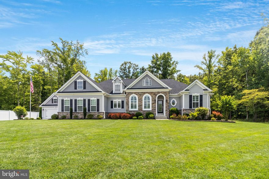 Why wait for new construction? This home has it all! Even a detached garage with electric! Built in 2019 by Quality Built Homes, discover perfection in this meticulously maintained 4-bedroom, 3.5-bathroom home offering an ideal blend of modern comfort and convenience. Step inside to find a spacious open floor plan illuminated by abundant natural light and high-end finishes throughout. The gourmet kitchen is a chef's delight, showcasing granite countertops, stainless steel appliances, gas cooktop, double oven, large island with seating and ample cabinetry for storage. The open family room boasts a coffered ceiling along with a stone fireplace and plantation shutters! The expansive primary bedroom  provides a peaceful retreat with a spa-like ensuite bathroom and generous walk-in closet. In addition, there is also a door from the bedroom that leads to its own entrance to the outside trex deck. Two large bedrooms are on the opposite side of the home along with a hall bathroom. Coming in from the 2 car garage, you enter a large mud room with a separate entrance to a large laundry room with plenty of space for all your laundry items. The finished basement has a full bathroom and another large bedroom or office, depending on your needs. There is spacious unfinished area that can be used for whatever your heart desires. From the finished area, there are stairs that lead to the backyard. Once outside, enjoy the privacy and beauty of an in-ground sprinkler system maintaining lush greenery in the landscaped yard, an oversized sidewalk and a trex deck which  is perfect for outdoor gatherings and relaxation. The very efficient solar panels, which are transferrable, are on the back of the house and basically eliminates your SMECO bill! This home  is in an ideal location if you need quick access to DC or points beyond but close to all local amenities! Schedule your private tour today and envision your future in this exceptional property. ASSUMABLE VA LOAN with 3.75% interest rate! Sellers prefers a local title company.