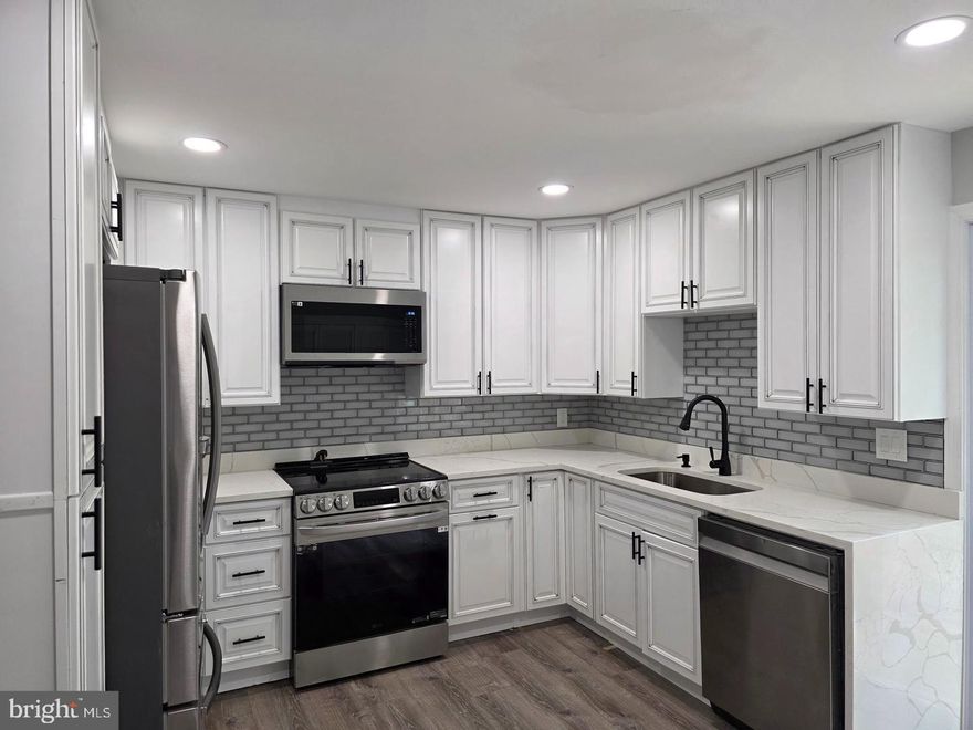 Kitchen has new Samsung stainless steel appliances, range, built -in microwave, French door refrigerator, quite dishwasher and new 42" kitchen cabinets, New vinyl plank flooring throughout house. New ceramic tile in bathroom. New HVAC. New ceiling fans. New large deck. Seller preferers to settle a t Jacquie's Title Group.