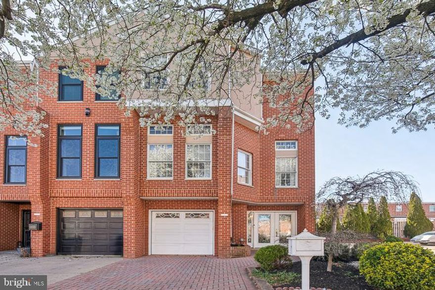 Rarely available! Welcome to 3220 Smedley Street, an Original A model corner unit in the highly sought-after Brinton Estates. This incredible corner home has exposure on the North, East, and West sides, this home is bathed in natural light all day.

Perfectly positioned adjacent to Packer Park, this stunning home offers unmatched accessibility - just seven minutes to the airport, five minutes to the Walt Whitman Bridge, and a short walk to the sports complex, casino, and a vibrant selection of restaurants and entertainment. Plus, the lush greenery of FDR Park is just moments away.

Spanning an impressive 2,530 square feet, this residence boasts four spacious bedrooms, 2.5 bathrooms, a one-car garage, and an additional parking spot in front for a second car or guest parking. A beautifully landscaped entrance welcomes you into the foyer, where one generous coat closets offer ample storage. The first level features a cozy family room, a convenient half bath, and a sunroom drenched in sunlight —ideal for an additional living space, playroom, gym, or home office. Additionally, a bonus kitchen with a sink, microwave, and stove/oven provides extra functionality, perfect for hosting gatherings or additional storage needs.

On the second level, the formal living room is a showstopper with oversized windows that flood the space with natural light. The adjacent kitchen is a chef’s dream, featuring a walk-in pantry and premium stainless steel appliances, including an oversized Viking refrigerator and a Wolf oven. A charming bay window brightens the dining area, while the elegant formal dining room, complete with crown molding, overlooks the living space.

Step outside onto the private deck, where a full-coverage automatic awning creates a perfect outdoor retreat—ideal for morning coffee or evening entertaining.

Ascending to the top floor, a beautiful skylight illuminates the staircase, leading to four generously sized bedrooms filled with natural light. Two well-appointed bathrooms complete this level, ensuring comfort and convenience for all.

This is a rare opportunity to own a corner unit in a charming, highly desirable neighborhood. Don’t miss out—schedule your tour today!