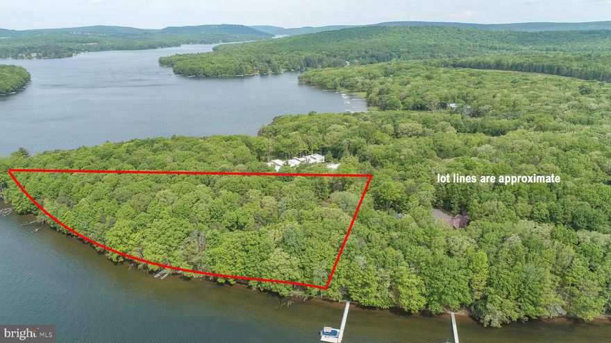 Get to the point!  This rare opportunity includes approximately 2.8 acres and 800' of prime water frontage at the tip of Crows Point in Thousand Acres.   With captivating views and plenty of privacy, this property is truly one of the most distinct properties ever offered on Deep Creek Lake.  

The 7 bedroom 4 bath retreat offers plenty of quality living space both inside and out.   An inviting primary suite  was added on the main level and offers a private bath and den.   A separate guest suite with 2 bedrooms and 1 bath is perfect for guests or overflow.  It also includes 2 garage spaces on the main level.  

When it comes to outdoor activities, the level property is ideal for all ages and offers one of the most secluded settings on the lake.   Water and lake views from several different vantage points are available on the 800+- feet of shoreline.    Sailing, boating, kayaking, fishing and just about any lake activity you can imagine are possible.   Walking, hiking, jogging, biking are encouraged along any of the many roadways throughout the community.  The property is located less than 1 mile from the recently completed Thousand Acres Golf Club.  A gem that has been receiving rave reviews.

The property currently is approved for 2 Type A docks.   but may be eligible for additional dock spaces.    Note, upper level rooms include 2 bedrooms and one bath in the carriage house above the garage.  

If you're looking for somethings special, this property should be on your radar.