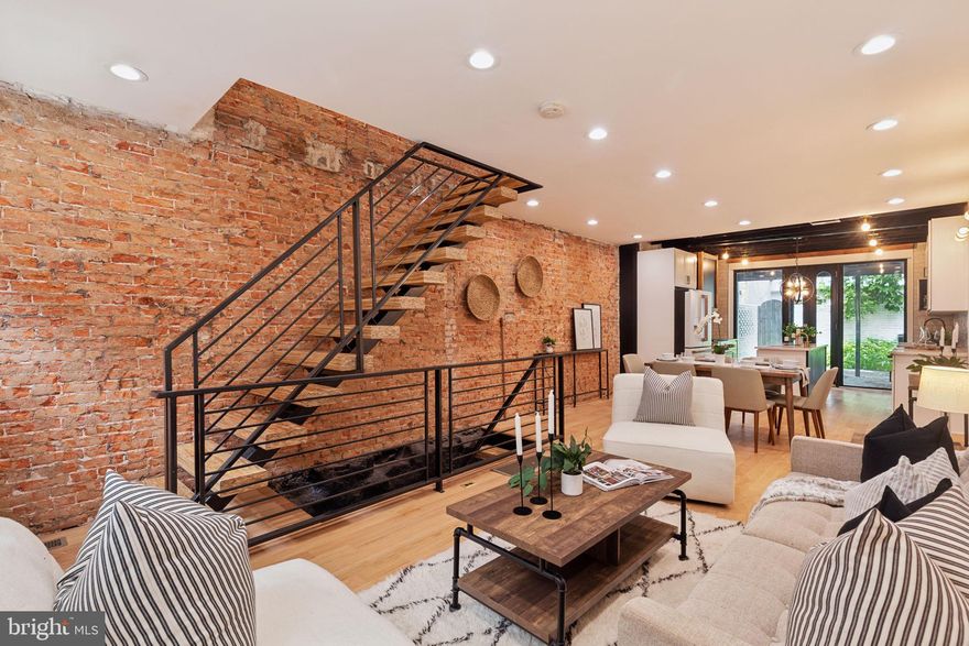 Welcome to 1937  Waverly Street, a beautifully renovated home located on a quiet street in Rittenhouse Square.  Walking into the home you are greeted by exposed brick, paneled walls and a floating staircase with 3 inch thick treads. As you make your way to the kitchen you are instantly attracted to the custom range hood and the use of reclaimed accents throughout the space. The kitchen is a beautiful mix of new and old along with top of the line GE Cafe appliances. The beauty extends outside of the house where you have a large backyard which is perfect for entertaining. Making your way up to the second floor you will find two spacious bedrooms along with a rear deck and full bath featuring custom tile work and designer lighting. Continue up to the third floor where you have an ensuite bedroom featuring a paneled accent wall and a huge walk-in closet. Enter the main bath and you will find a custom built double vanity, large stand up shower and beautifully designed soaker tub ideal for relaxation. To top it all off head down stairs to the fully finished basement. Property Walk Score is a 97 along with being located in Greenfield Catchment!