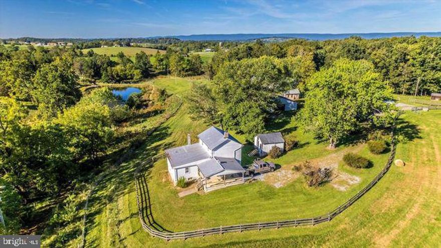 A rare opportunity to own a beautiful, large 157 +/- acreage farm with a single family updated farm house in the sought after area of Frederick County with a  view of the Catoctin Mtns. THE CURRENT LOAN/MORTAGE MAY BE ASSUMABLE BY QUALIFIED APPLICANTS AT THE CURRENT TERMS & A RATE OF 2.25% TIL THE YEAR 2037. With a fenced perimeter of approx, 2.5 miles, properties like this are rare & in high demand. This unique property abounds in character and has the feeling of being secluded without being far from restaurants, shopping & banking. Property consists of fields/pasture, woods, ponds, creek and an updated farm house.
Just north of Rt 70 off of Rt 75 its an easy commute to Wash. DC., Baltimore & surrounding areas. A wonderful property for the equestrian trail rider or outdoor enthusiast. The property is capable of producing a yearly income of over $40k from leasing fields, pole barn rent for equipment or hay, house rent & income from CREP program. All of which pays for the taxes & insuranse without lifting a finger. Property is in a Conservation Easement which still allows many options for the owner such as; building houses for children,  business operation, no public access, demolish existing structure & build new at current site or relocate elsewhere on property.
Many of the surrounding properties are in Conservation Easements too which protect the area from commercial or high density development.
Property includes;
* 4 strand energized fenced pastures for livestock.
* Ag well to include water lines, frostfree hydrants & automatic watering troughs at pastures.
* 2 pole barns...42x80 & 32x80
* Taxes are approx $2100 annually.
* Second building rite exists with an  approved perc for a conventional septic system (NOT mound system) for a SFD. Well is installed.