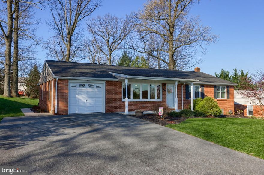 Nestled on a generous .48-acre level lot, this meticulously maintained all brick rancher offers a private retreat with convenient access for commuters. Step inside to discover three comfortable bedrooms and two full bathrooms. The main level boasts a well-appointed kitchen featuring elegant granite countertops, a stylish tile backsplash, and an abundance of cabinet space. Sunlight streams into the gorgeous sunroom, providing a tranquil space to relax and enjoy the serene backyard views. Th​e lower level features a fantastic finished rec room with cozy gas stove, perfect for movie nights or entertaining​, plus a spa-like full bath. The lower level also offers additional storage solutions.  ​Also included is a large shed for extra storage, a practical 1-car garage, and an oversized driveway providing ample off-street parking. Just minutes from I-83, this home is perfectly situated for easy commutes to York or Maryland.​ With no detail overlooked, pride of ownership shines throughout this home​. All that's left for you to do is move in!