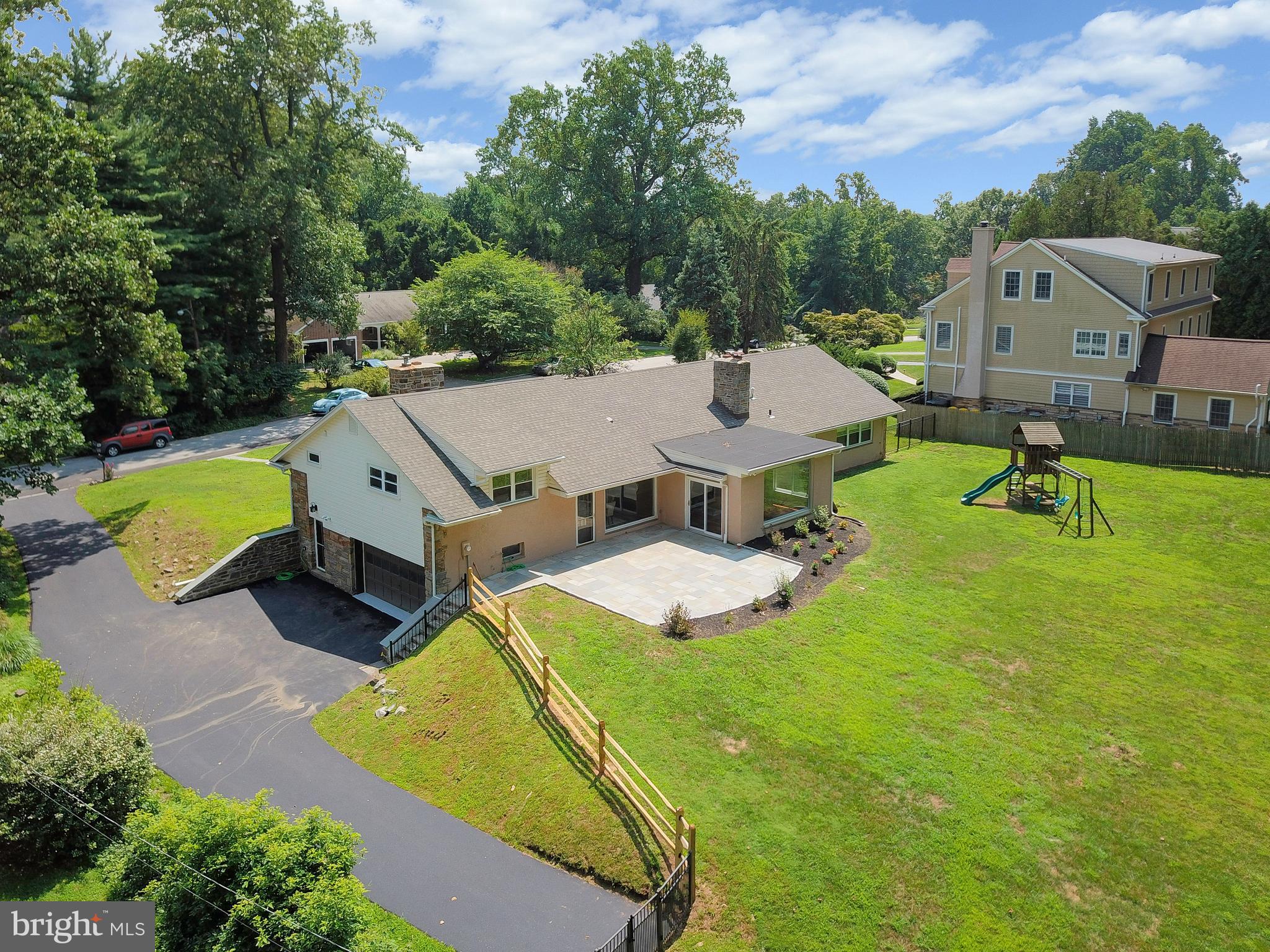 This is an extraordinary home nestled on a quiet and beautiful street in Lower Merion. Level landstretching close to one acre enfolds this sprawling 5 bedrooms 3 full baths classic stone house.There are TWO spacious master suites with one having a wood-burning fireplace. In addition,there are 3 nicely sized bedrooms with a newer hallway bath. Recent updates, include but notlimited to, hardwood floors, two full baths, electrical wiring throughout the entire house, allinterior doors, conversion to gas boiler for heating, ceiling, water heater, replacement of centralair system, roof, gutters with gutter guards, stone patio, and a resurfaced and seal coateddriveway. Natural light floods through all areas of the home while hardwood floors and freshneutral paint flow from room to room. A generous dining room with a breathtaking view of thebackyard and a wood-burning stone fireplace in a large living room with huge picturesquewindows add to the beauty of this home. A gourmet kitchen filled with gleaming stainless steelappliances, ground level laundry, and a 2-car garage with inside access are present in this lovelyhome. A brand-new blue-stone patio with an outdoor playset decorate the grounds. A marveloushome with move-in ready condition.