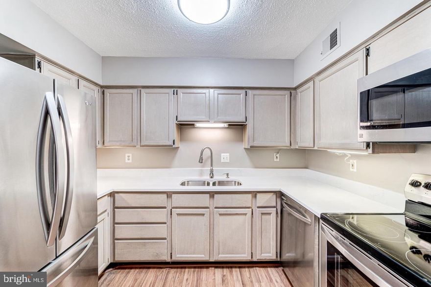 Rarely available Marseille model in the Chateaux Condominium on the quiet side of the development opens to the courtyard. Large 2 bedrooms and 2 bathroom condo recently updated with quartz countertops. Kitchen also features stainless steel appliances in kitchen. Hardwood floors throughout the home! Newer HVAC. Remodeled bathrooms, fresh paint, all hardwood floors, upgraded lightning and new recessed lighting. Master bedroom closet is 15x8! Unit comes with one parking garage spot and two parking stickers. Washer and dryer in unit and  ALL UTILITIES included in rent. Community is very private with picturesque grounds but so convenient to all of Northern Virginia and DC. This home also has a wonderful large patio for outside gatherings. Convenient to 7 corners, Eden Center, Bailey's Crossroads - bus stop right outside development.