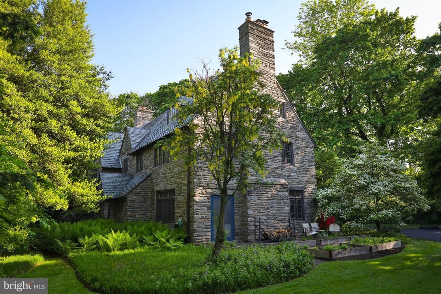 Designed in the Cotswolds style by the esteemed architectural firm Duhring, Okie, and Ziegler in 1928, this stunning 7-bedroom, 4 1/2-bath property on one of the most iconic residential streets in Chestnut Hill is an entertainer's dream! Perfect for hosting family and friends, the first floor features an updated, spacious eat-in kitchen with a wet bar and cozy sitting room. A large mud room with laundry and plenty of storage adjoins the kitchen. French doors lead from the kitchen into the dining room, which is surrounded by windows and anchored by a large wood-burning fireplace that creates a warm atmosphere for winter nights.  A grand foyer with arched doorways to the kitchen and living room, a powder room, and a cozy office/ den with built-in bookshelves and a private entrance occupy the middle portion of the first floor. With windows on three sides, built-in shelving, and a stone fireplace with an intricately carved mantel, the large living room is ideal for hosting gatherings, and there's plenty of space for rolling up the rug and dancing.

Off the landing to the second floor, a recently remodeled space could serve as second-floor family room or large bedroom with its own full bath. The second floor features two spacious bedrooms with a Jack and Jill bathroom between them, a third sunny bedroom that the current owners use as a exercise room, and a large primary bedroom featuring an updated en suite full bath and a working fireplace for an extra touch of luxury. 

The third floor offers versatile living options, either as an in-law suite, home office, or additional bedrooms for guests and also features a large cedar closet and plenty of storage spaces.

Outside, the beautifully landscaped yard boasts a well-tended perennial garden; fully fenced back yard; two slate patios accessed by French doors from the living room, dining room, and kitchen; an in-ground pool with flagstone hardscaping; and an outdoor shower—ideal for entertaining or relaxation in this urban oasis.  

Located in a private setting with no neighbors on either side, this home is an easy walk to Chestnut Hill's shops, the Philadelphia Cricket Club, schools, Pastorious Park, and the trails of the Wissahickon Valley. Steps away from the Highland SEPTA Regional Rail station and only a 90-minute commute to New York City, it's truly a rare opportunity to own your private retreat in the city.