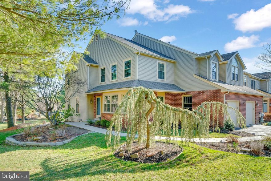 Understated, serene, and bathed in natural light, 296 Conway Circle is a very special Gwynedd Hunt home that you do not want to miss. This private, end unit townhome is tucked away at the end of minimally traveled cul-de-sac, surrounded by mature trees and open space. Although mother nature is still slumbering, those with a discerning eye will notice the thoughtfully planted perennials, shrubs, and trees that adorn the home. As you approach the home and round the newly paved front walk, you will note the extensive (and recently done) hardscaping which includes a lovely fieldstone wall and handsome large steppers progressing to smaller stepping stones, which lead to a stunning flagstone patio. Inside the home, you are greeted by a two story foyer boasting views into the living room, dining room, kitchen, and second floor above. At first glance, you will be thrilled to see an abundance of windows, bringing in bountiful natural light which beautifully plays off the clean and neutral color palate. Another aspect to love about this home is the open floor plan and comfortable flow. The spacious living room is surrounded by carriage style windows and features a gas fireplace and hardwood flooring. Due to the open floor plan, the living room offers views into the adjacent family room and connected kitchen. If you are one who enjoys entertaining, this space is truly ideal. The open kitchen provides the all important “work triangle”, under cabinet task lighting, and plenty of counter space, allowing you to be a culinary workhorse, all while maintaining connectivity to your guests (or family). You will appreciate the granite countertops, stainless steel appliances, plenty of cabinet storage, and counter seating for four. A reverse osmosis system ensures that you have filtered drinking water (and ice) at the ready. The dining room with lovely bay window is on one side of the kitchen, perfect for more formal meals, and the other side is open to the family room, ideal for everyday living. The family room features a three panel French door, offering access to the deck, and views of the open space beyond. The first floor also offers a powder room, coat closet, and access to the attached garage. As you head upstairs, you will see that the stairwell treads were recently replaced with oak treads to match the oak hardwood that was installed throughout the second floor (with the exception of the bathrooms). To your left, you will find the primary suite, featuring a generous bedroom, changing area with two closets (including one walk-in), and a large bathroom offering a dual vanity, soaking tub, separate shower, and linen closet. The second floor also offers two nicely sized additional bedrooms, a shared hall bathroom that was recently renovated, linen closet, and the conveniently located laundry room. Down below, the basement is unfinished, but quite spacious, clean and bright; allowing plenty of room for storage. Outside, there is a roomy deck in the rear of the home, constructed of carefree composite material.A privacy fence creates a buffer on one side, and nature does the rest. If you have little ones or a four legged baby, you will appreciate the gated deck to contain those on the move. When the temperatures spike or there’s a light drizzle, you can still enjoy this lovely outdoor space under the retractable awning. Through the gate, a short set of stairs leads to a flagstone patio. The owners have made numerous improvements during their short time here, many of which would not have been done had they known they would be leaving so soon, however, this is of great benefit to you. Please inquire for a full list of improvements, but some highlights include; all new windows (less the garage window), a new roof, renovated shared hall bath and powder room, new hardwood flooring, new appliances, and extensive landscaping/hardscaping. 296 Conway offers elegant and refined living in an ideal location within the attractive Gwynedd Hunt community.