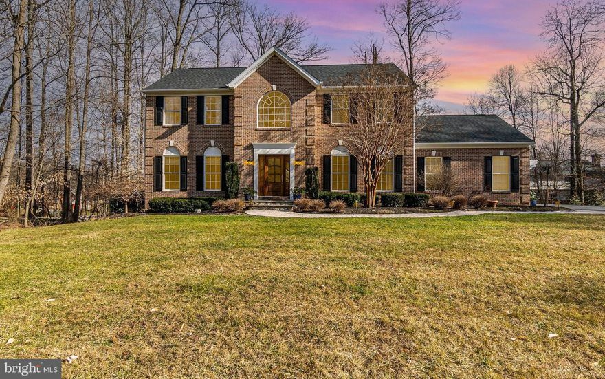 Welcome to this beautiful Colonial in the desirable Woodcrest community nestled in a cul de sac. Cozy is the best description for this home. Boasting 4 bedrooms, 3 full baths, one powder room, a fully finished lower level, and 2 car garage. This home is cozy and stylish while keeping it traditional. Upon stepping inside, you'll be greeted by an open-concept floor plan that is functional and spacious. The kitchen and family room are illuminated with recessed lighting and extensive amounts of natural light with abundant windows. no lights are needed during the day. The open and large family room boasts a cozy gas fireplace and is the perfect place for entertaining at a family event.  Walk into the office with custom walnut built-ins and custom plaster walls perfect for working at home.  The main floor has crown molding throughout and updated 5 ¾ baseboards.

The upper level has 4 bedrooms with an updated ensuite and hallway bathroom.  The primary bedrooms and hall are hardwood.
The lower level is fully finished, with wood floors, custom built-ins for your entertainment /stereo system hookups, recessed lighting, a wet bar with dishwasher and TV, a desk/craft area, a full bath, and a walk-out lower level with French doors waiting for your patio design.
Step outside the sliding glass door right off the kitchen onto the oversized trex deck with vinyl railings.  See pictures for the beautiful setup with cafe lighting and sails that are perfect for  3 seasons entertaining area.  Sit back, relax, and enjoy the view of the mature tree-lined yard and quiet neighborhood that is tucked away.  Enjoy the stone pathway leading up to the bluestone front porch and custom mahogany door with a fresh stain.
Other notable improvements include a roof replacement in 2021, a new well pump and tank in 2023, the majority of the house has been freshly painted in neutral colors, custom built-in lower level and office, upgraded stairs/ railings, updated bathrooms, fully finished lower level, hardwood floors through the house, new carpet in 3 bedrooms and house generator.
Don't miss the opportunity to make this house your new home.