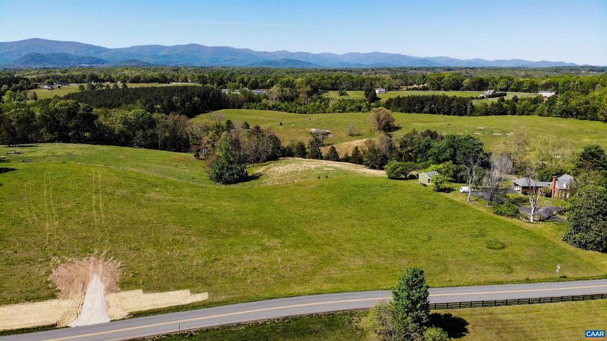 Stunning year round mountain views over farmland. State road frontage, only 15 minutes to Hollymead Town Center. 4 bedroom Conventional drain field approval. Driveway stubbed in. Underground power already install to the property. Mild C&R's in place. Custom home package also available.