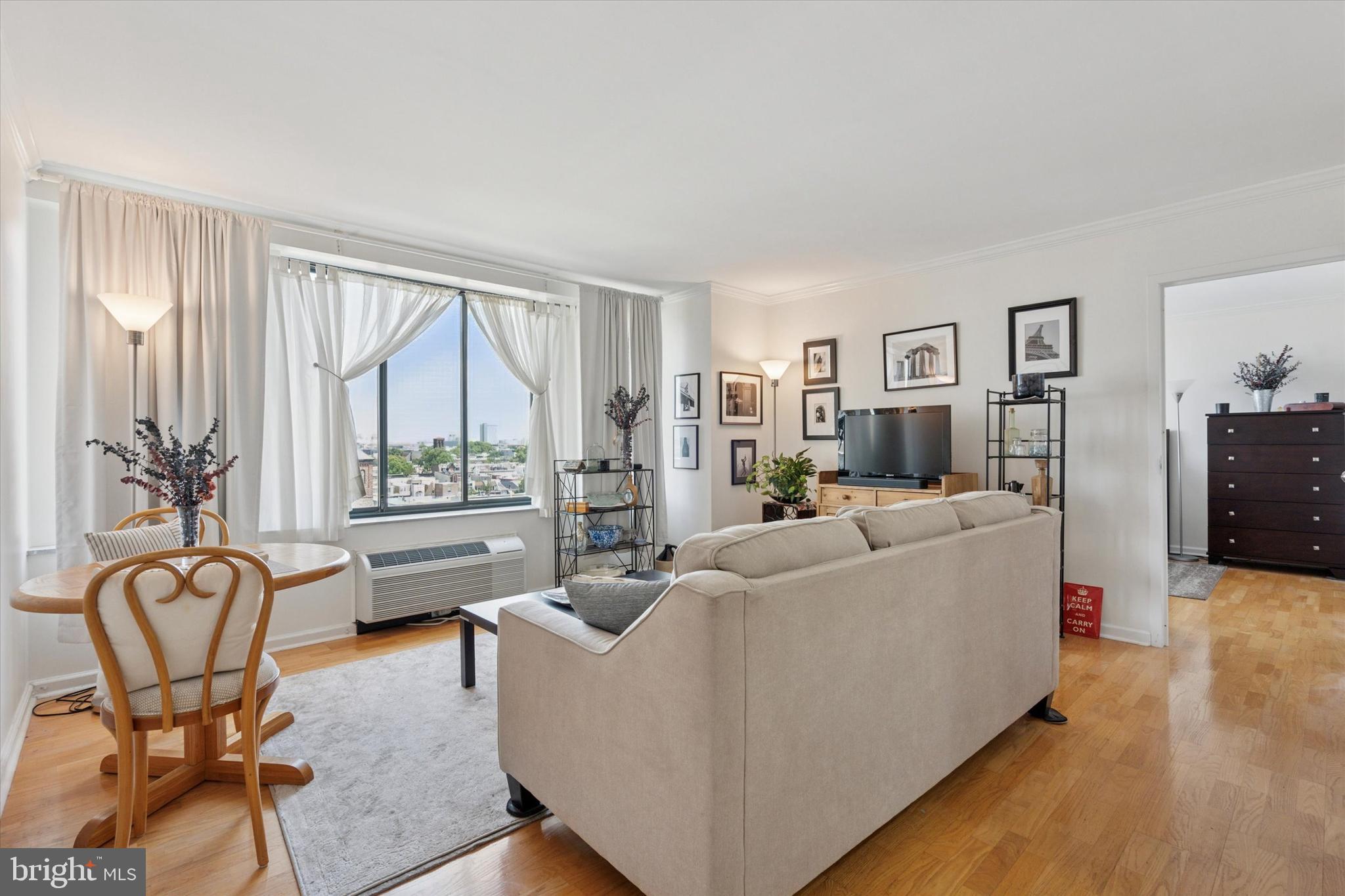 CityView Condominiums, South Tower Unit #1205 with dedicated, covered PARKING on the first floor and lowest HOA fee in the area is ready for you to call home. This beautiful, bright and spacious 2 bedroom, 2 full bathroom unit with serene Northern Views awaits! (The second bedroom can also serve as an office or an additional dining space.) Stylish, updated open floor plan offers hardwood flooring and crown moulding throughout, generous closets and storage, full size washer and dryer in unit and more. The open gourmet kitchen with pass through offers stainless steel appliances, healthy cabinet space and light granite countertops. The living space is perfect in size and scale. Both bedrooms have an ensuite bathroom and the layout is also ideal for roommates, offering a pair of large bedroom suites on opposite wings with two entrances. The primary bath has double vanities with mirrored cabinets inside and out. This is a turn key unit, move-in ready. CityView residents enjoy resort-style amenities including a 24-hour concierge, landscaped grounds, outdoor heated salt pool, fitness center, business lounge, library, grocery/pharmacy onsite and garden courtyard with gazebo and plenty of green space all just an elevator ride away. Located in the highly sought-after Art Museum/Fairmount neighborhood, ideally located just off the scenic Ben Franklin Parkway, steps from the Barnes Foundation, Rodin Museum, and the iconic Philadelphia Museum of Art. Enjoy neighborhood favorites like Pizzeria Vetri, Sabrina’s Café, and Bar Hygge, with Whole Foods, Target, and Kelly Drive just around the corner. Whether you're seeking a serene urban retreat or the convenience of everything Philadelphia has to offer, this is city living at its best. Come see, come fall in love. Photos @Alcove Media @Chuck Homler