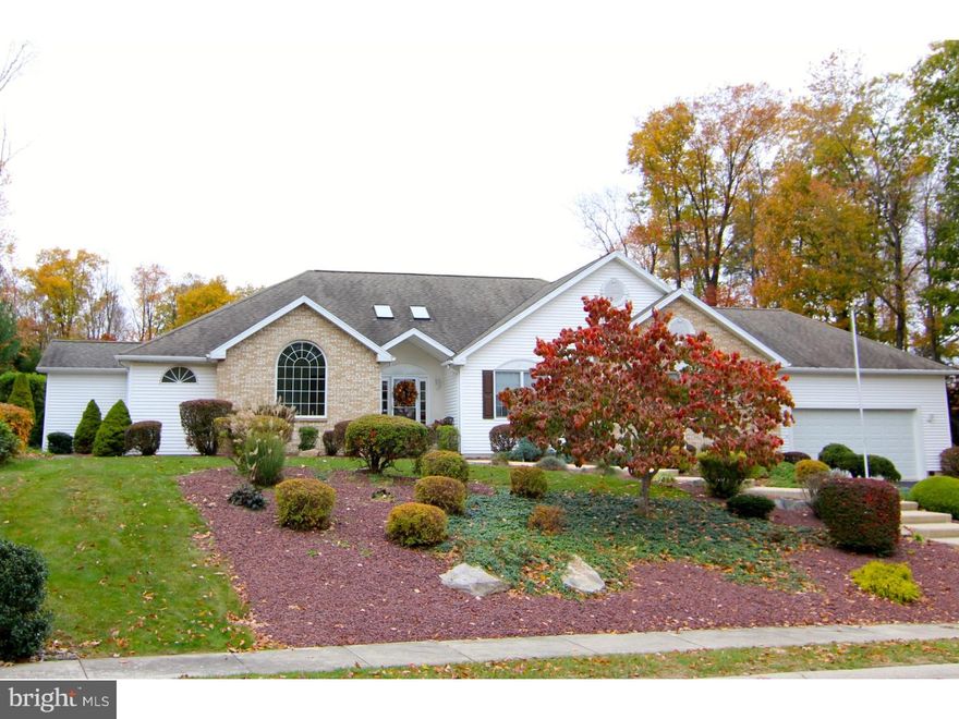 Custom built luxury ranch home on professionally landscaped private lot. Grand skylit foyer opens to an impressive family room with tray ceiling and fireplace; adjacent spacious gourmet kitchen is outfitted with new ss appliances, wet bar, oversized island and breakfast area. The star of the home is the privately situated master bedroom with en-suite bath, den/office and dream skylit walk-in closet. Main floor also includes a formal living room with a soaring cathedral ceiling, two guest bedrooms a guest bath. Finished lower level includes two additional bedrooms and rec room with wet bar.