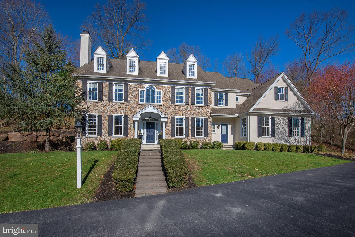 Impressive 9 year young Custom Colonial Manor Home situated on a private cul-de-sac in the desirable community of Water Mill Estates. This quiet enclave is situated at the Southern Edge of Springton Lake. The homes of Water Mill feature classic architectural details. flowing, innovative floor plans and modern amenities. The homes are situated on these two scenic cul-de- sacs overlooking Springton Lake and were custom built by Chip Vaughan, Ted Moser and Lee Haller. This home was built Ted Moser and sits majestically on this 1.9 acre lot with room for a pool. Exterior features include a beautiful stone and stucco facade with charming portico entrance, flagstone walkway with paver border leading to driveway, custom paver patio and hot tub overlooking expansive grounds and custom landscaping. Interior features include beautiful just refinished hardwood floors, two fireplaces, beautiful custom millwork and wainscoting, six panel doors, elegant lightning fixtures and very spacious room sizes. The elegant thru Center Hall leads to French Doors to large cobblestone patio and also features stunning turned staircase. Impressive Cased openings lead to Living Room with Traditional Fireplace with gas logs and on the other side to Formal Dining Room with wainscoting and crown molding adjoining charming Butlers Pantry with wet bar with granite countertop with integral stainless steel sink with brush nickel faucet, Marvel Wine cooler and glass accent cabinetry. The gourmet granite kitchen features custom Century cabinetry, a large granite island with two elegant hanging pendant lights and top of the the line stainless steel appliances including a Sub Zero refrigerator. The kitchen accesses a large mud room with coat closet , built in cubbies and bench , rear staircase, entrance to three car garage, side door entrance and a private powder room. A sunny morning room with three walls of windows adjoins kitchen and spectacular fireside family room with floor to ceiling stone fireplace with flagstone mantel and hearth and beautiful built in bookcases flanking Flat screen TV. The private study and formal powder room complete the first floor level. Double Door Entrance to Elegant Master Suite featuring large bedroom with tray ceiling, and charming sliding barn door to dressing area with his and her closets and entrance to sumptuous marble master bath with an oversized whirlpool tub under triple window and separate large walk-in shower with shower seat and multiple shower heads and private commode room. Second bedroom offers walk in closet and access to bath with large Cherry vanity with double bowl sink and separate room with tub with shower and commode. Bedroom #3 features double window and walk in closet and connects to Jack and Jill Bath with corian top vanity and Bedroom #4 with double door closet and neutral carpeting. Bedroom #5 has access to an additional storage area or future computer/ media or possible fourth bath. A large second floor laundry featuring ceramic tile floor with built in sink and cabinetry complete this level. Daylight Lower Level with outside entrance with stairs to Bilco doors to side yard could be easily finished to add more living space and has been pre-plumbed for a bathroom. No detail has been left unfinished in this Spectacular Home which is perfect for elegant entertaining as well as active family living. This home is convenient to all major highways for commuting to Center City, Wilmington, and the Airport and within minutes to the local shops and restaurants in Media and Newtown Square. Please note that Delaware County is conducting a real estate tax reassessment, effective January 1, 2021. If you have any questions or concerns about the impact of this process on the future real estate taxes for this property, you should contact the Delaware County Treasurer's Office.