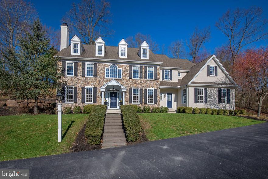 Impressive  9 year young Custom Colonial Manor Home situated on a private cul-de-sac in the desirable community of Water Mill Estates. This quiet enclave is situated at the Southern Edge of Springton Lake. The homes of Water Mill feature classic architectural details. flowing, innovative floor plans and modern amenities.   The homes are situated  on these two scenic cul-de- sacs overlooking Springton Lake and were custom  built by Chip  Vaughan, Ted Moser and Lee Haller.  This home was built Ted Moser and sits majestically on this 1.9 acre lot with room for a pool.   Exterior  features  include a beautiful stone and stucco facade with charming portico entrance, flagstone walkway with paver border leading to driveway, custom paver patio and hot tub overlooking expansive grounds and custom landscaping.  Interior features include beautiful just refinished hardwood floors, two fireplaces, beautiful custom millwork and wainscoting, six panel doors, elegant lightning fixtures and very spacious room sizes.  The  elegant thru Center Hall leads  to French Doors to  large cobblestone patio and  also features  stunning  turned staircase.  Impressive Cased openings lead to Living Room with Traditional Fireplace with gas logs and on the other side to Formal Dining Room with wainscoting and crown molding adjoining charming  Butlers Pantry with wet bar with granite countertop with integral stainless steel sink with brush nickel faucet, Marvel Wine cooler and glass accent cabinetry.  The gourmet granite kitchen features custom Century  cabinetry,  a large granite island with two elegant hanging pendant lights and top of the the line stainless steel appliances including a Sub Zero refrigerator.  The kitchen accesses a  large mud room with coat closet , built in cubbies and bench , rear staircase, entrance to three car garage, side door entrance and a private powder room.  A sunny morning room with three walls of windows adjoins kitchen and spectacular fireside family room with floor to ceiling stone fireplace with flagstone mantel and hearth and beautiful built in bookcases flanking Flat screen TV.  The private study and formal powder room  complete the first floor level.  Double Door Entrance to Elegant  Master Suite featuring large bedroom with tray ceiling,  and charming sliding barn door  to dressing area with his and her closets and entrance to sumptuous marble  master bath with an oversized whirlpool tub under triple window  and separate large walk-in  shower with shower seat and multiple shower heads and private commode room.  Second bedroom offers walk in closet and access to bath with large Cherry vanity with double bowl sink and separate room with tub with shower and commode.   Bedroom #3 features double window and walk in closet and connects to Jack and Jill Bath with corian  top vanity and Bedroom #4 with double door closet and neutral carpeting. Bedroom #5 has access to an additional storage area or future computer/ media or possible fourth bath. A large second floor laundry featuring ceramic tile floor with built in sink and cabinetry complete this level. Daylight Lower Level with outside entrance with stairs to Bilco doors to side yard  could be easily finished to add more living space and has been pre-plumbed for a bathroom. No detail has been left unfinished in this Spectacular Home which is perfect for elegant entertaining as well as active family living. This home is convenient to all major highways for commuting to Center City, Wilmington, and the Airport and within minutes to the local shops and restaurants in Media and Newtown Square. Please note that Delaware County is conducting a real estate tax reassessment, effective January 1, 2021. If you have any questions or concerns about the impact of this process on the future real estate taxes for this property, you should contact the Delaware County Treasurer's Office.