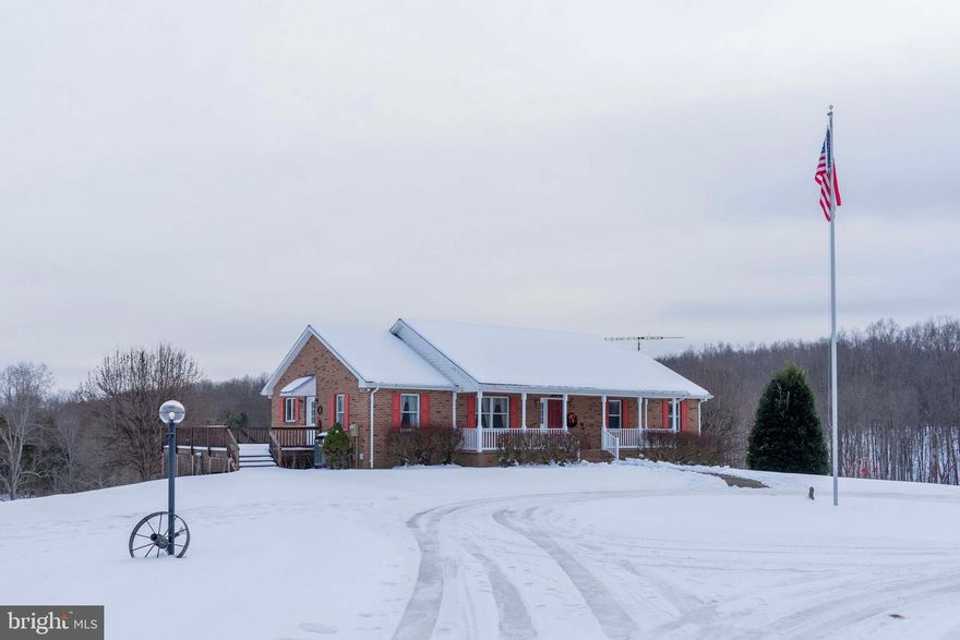 Custom Brick Home on 12.6 Acres with Barns, Pond & Creek nestled on 12.6 rolling acres of picturesque land, this custom-built brick home offers the perfect blend of comfort, and versatility. The property includes a charming small pond, a flowing creek, open fields, and two large barns—ideal for storage, animals, or running a home-based business. The home boasts 3 spacious bedrooms and 3 full baths, with the primary suite conveniently located on the main floor. Enjoy formal living and dining rooms, a cozy family room featuring a brick gas fireplace, and a well-designed kitchen. The expansive wraparound deck and screened porch offer plenty of space to enjoy the beautiful outdoors. The lower level provides additional living space, including a great room with a wood-burning fireplace, two versatile rooms perfect for a home office, gym, or playroom, and a full bath. There's also a utility room and easy access to the attached garage. Step outside from the walkout basement to a large patio with a relaxing porch swing, perfect for unwinding at the end of the day. The paved & concrete circular driveway provides ample parking. The property is ideally suited for outdoor enthusiasts, hobbyists, or anyone in need of a private retreat with plenty of room to grow. Don't miss your chance to own this unique, spacious home with endless possibilities! This home is a rare find, offering privacy, space, and functionality in a beautiful country setting! Adjoining acreage may be available for purchase.