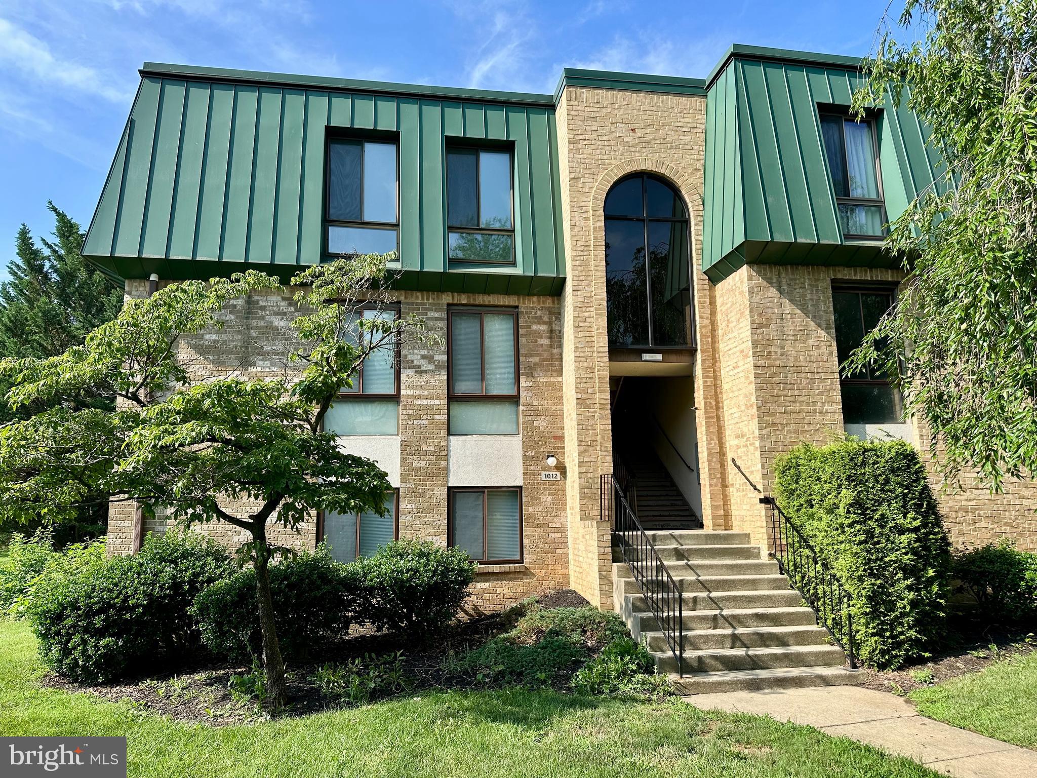 Enjoy low maintenance living in this 1 bedroom, 1 full bathroom condo with a den in Woodcrest Village! Fresh paint and beautiful LVP flooring, this unit is move-in ready! The spacious family room opens to a private, covered porch—perfect for relaxing. The kitchen features stainless steel appliances, including a refrigerator, dishwasher, microwave and stove, while the dining room adds to the open flow of the space. Enjoy the convenience of a stackable washer and dryer included in the unit. Central heating and cooling provide year round comfort. The condo association takes care of water/sewer, trash, lawn maintenance, and snow removal, making your life easier. Ideally located near I-70, I-81, shopping, restaurants, and schools. Plus, this condo is FHA-approved. Don’t miss the chance to make this wonderful home yours! Additional photos will be uploaded later today.