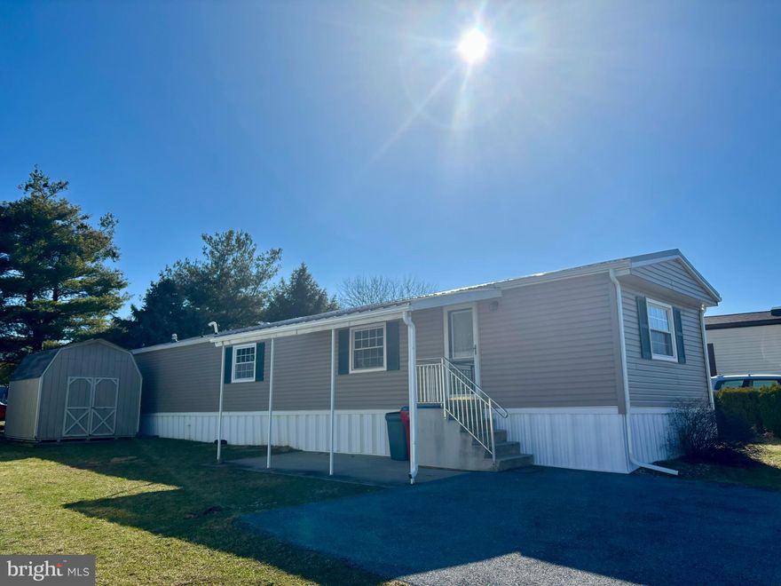 This charming 2-bedroom, 1.5-bathroom manufactured home in Laurel Commons offers a perfect blend of comfort and functionality. Built in 1990, the traditional design features durable aluminum siding and inviting laminate plank flooring throughout. The spacious living area is enhanced by ceiling fans, ensuring a cozy atmosphere year-round. The well-appointed kitchen comes equipped with essential appliances, including a single oven, dishwasher, microwave, washer, dryer, and refrigerator, making meal prep and laundry a breeze. Enjoy the convenience of in-unit laundry, allowing you to manage your chores effortlessly. With a total of 980 sq. ft. , this home provides ample space for relaxation and entertaining. The property includes a shed for additional storage and offers on-street and driveway parking for your convenience. Located less than 10 miles from the Reading airport, this home is ideally situated for easy travel. Experience the warmth and comfort of this delightful residence, perfect for creating lasting memories.